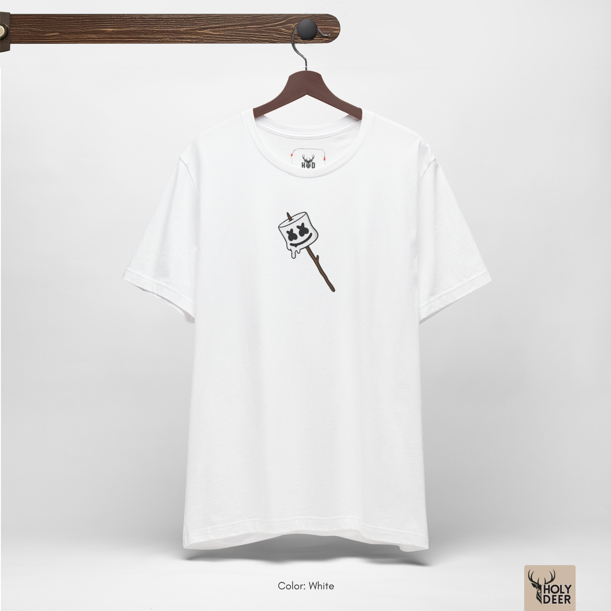 High-magnification print detail tracking the dripping gooey white ink edge, dense black cross eyes, and smooth curved mouth outline forming the face of the toasted marshmallow tee.
