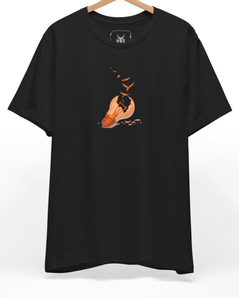 Premium Freedom Tshirt displaying a unique broken idea tee freedom concept light bulb birds graphic shirt layout on a black graphic tee backdrop, designed by Holydeer Clothing.