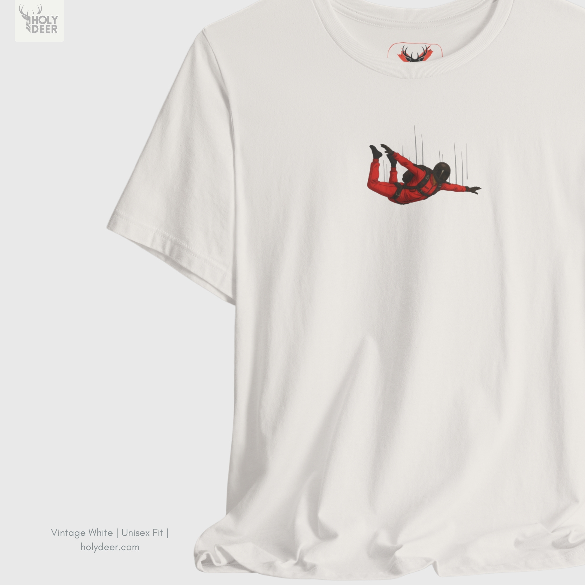 Soft cloud white ray shadow studio backdrop framing the unique Skydiving Shirt by Holydeer Streetwear, magnifying the clean centered small chest design placement and premium modern graphic tee presentation.