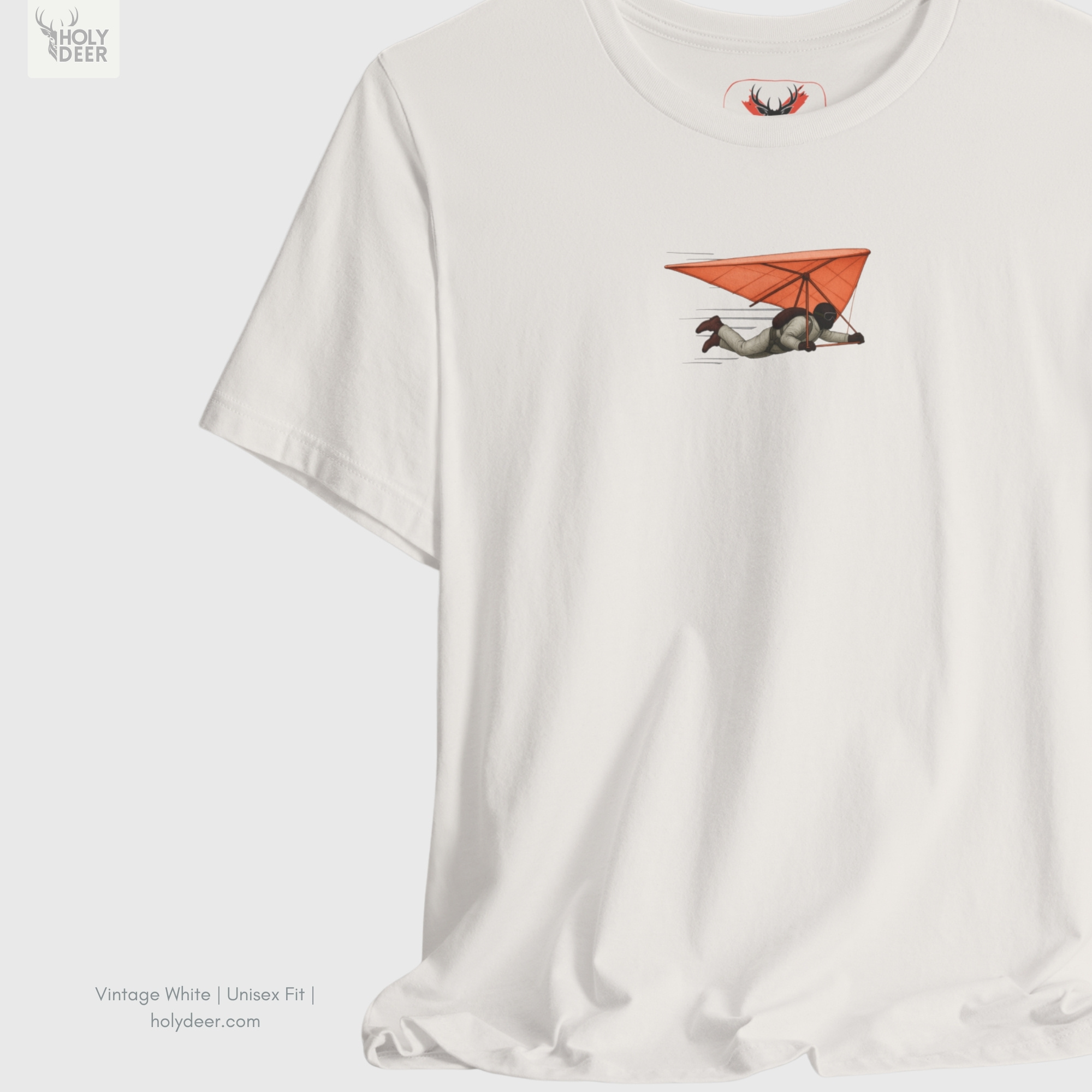 Brutalist airfield hangar concrete architecture outdoor lifestyle model wearing the off-centered Hang Glider Tee from Holydeer Clothing, standing as a high-end air sports shirt statement matching elite extreme flying trends.