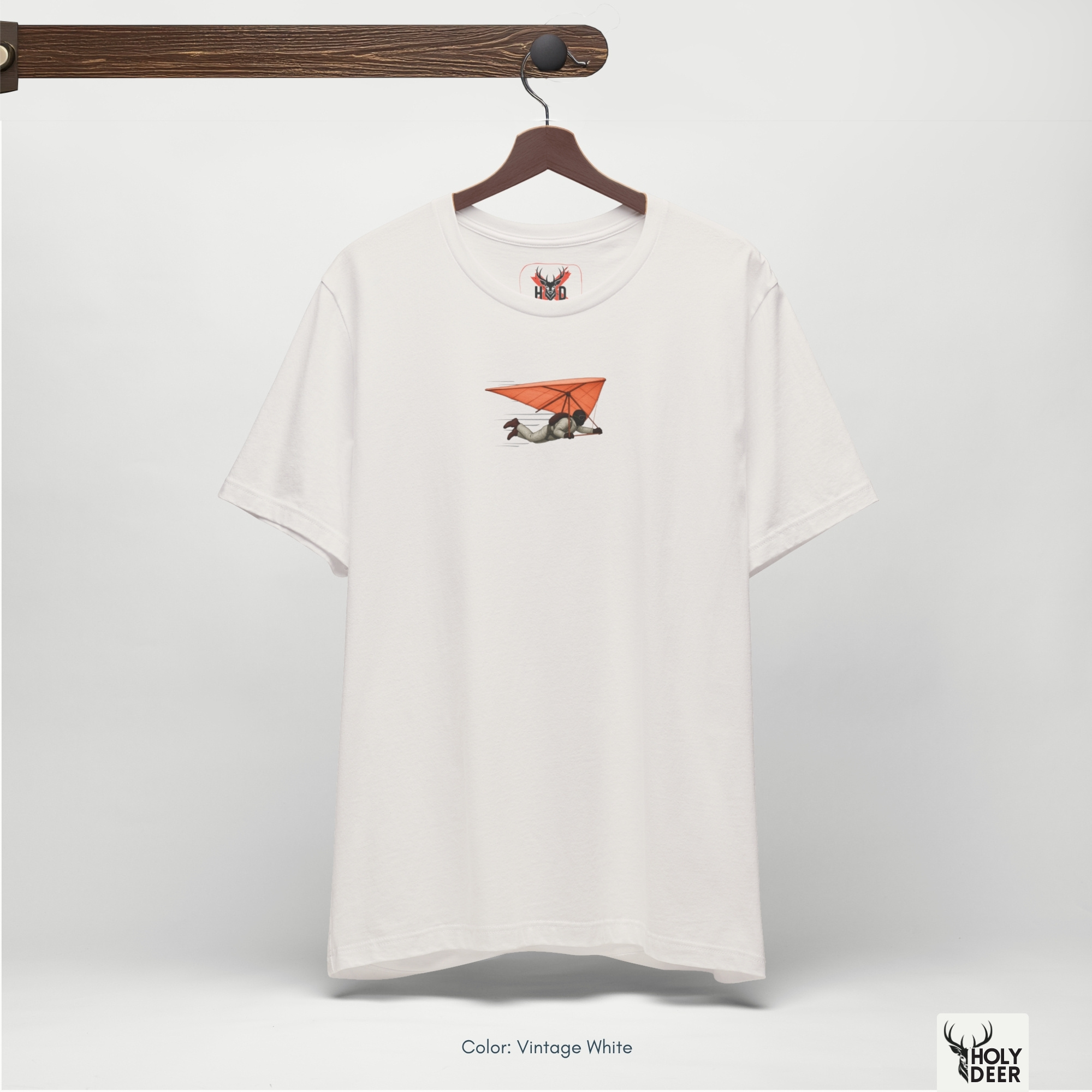 Soft aero-blue ray shadow studio backdrop framing the unique Hang Glider Tee by Holydeer Streetwear, magnifying the clean off-centered flying sport tee placement and premium sky glider tee presentation.