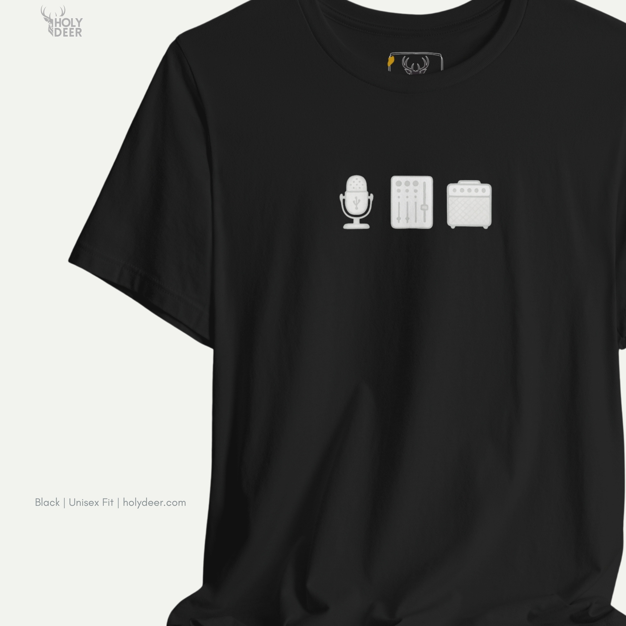 High-magnification print detail tracking the perforated grille dots, central capsule mounting loop, and realistic shadow paths forming the head of the sound designer tee.