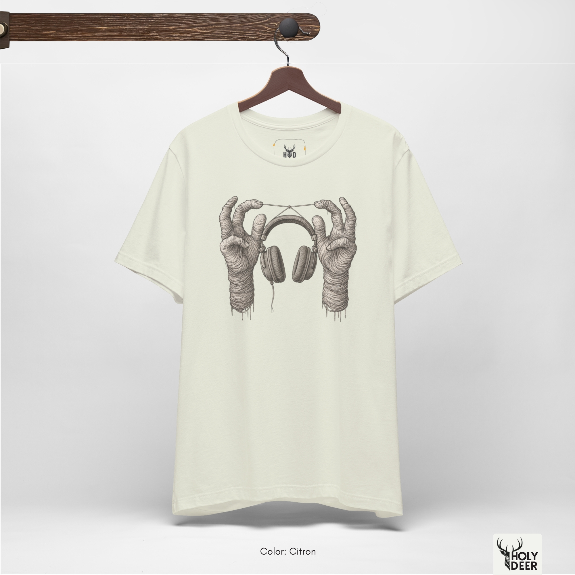 Soft dramatic shadow studio backdrop framing the unique Surreal Music Tee by Holydeer Streetwear, magnifying the clean centered abstract sound art placement and premium creative sound tee presentation.