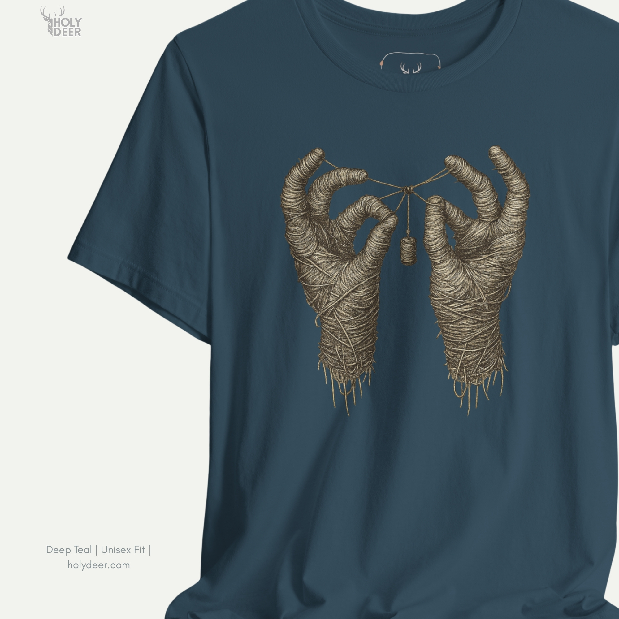 Professional flat lay photography of the Mummy Hands Shirt by Holydeer Apparel, arranged cleanly next to aged linen bandages, carved stone scarab amulets, and horror aesthetic lifestyle essentials.