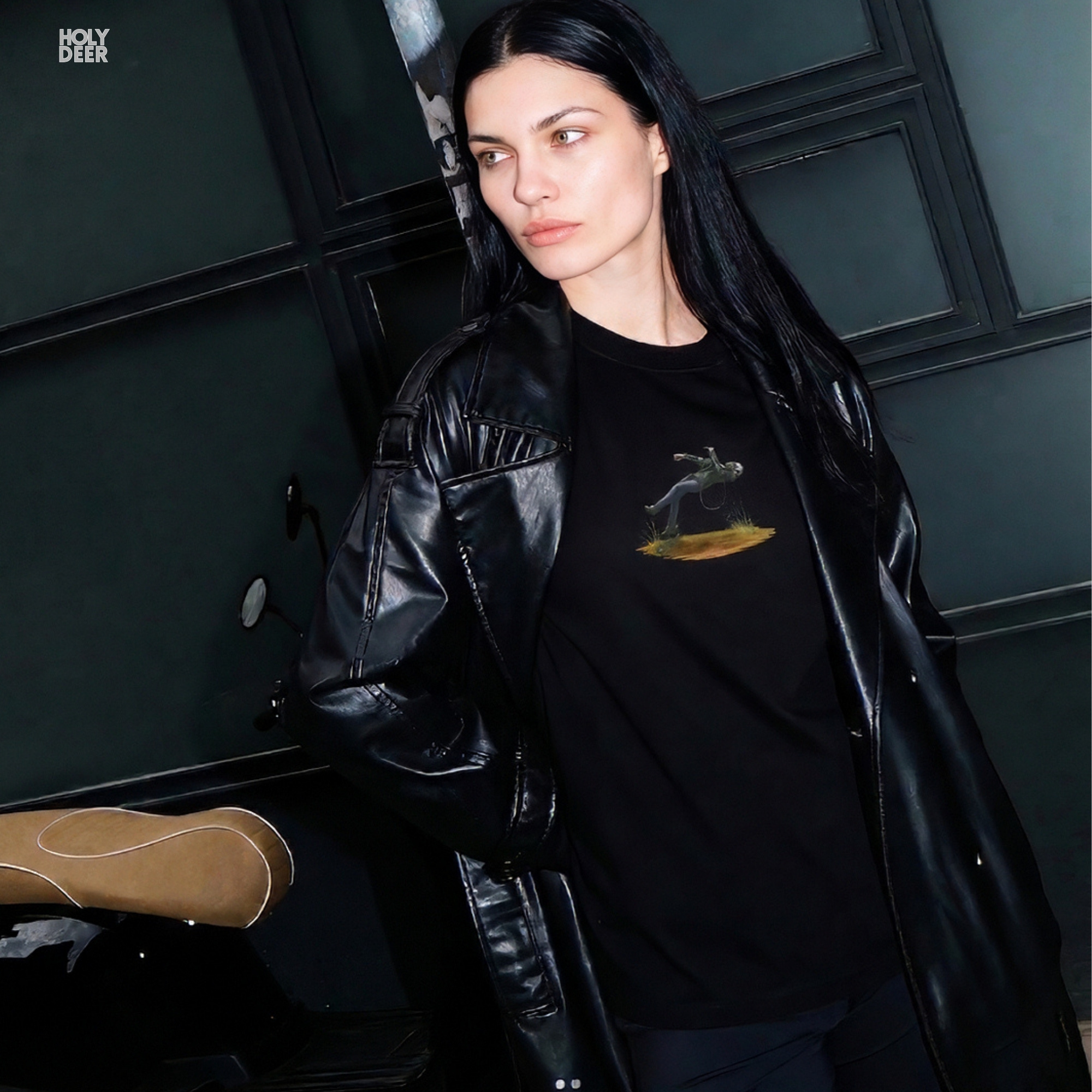 The iconic Techno Graphic Tee hanging cleanly on a luxury wood hanger, highlighting the robust neckline structure, crisp centered print flow, and the official holydeer.com retail tags.