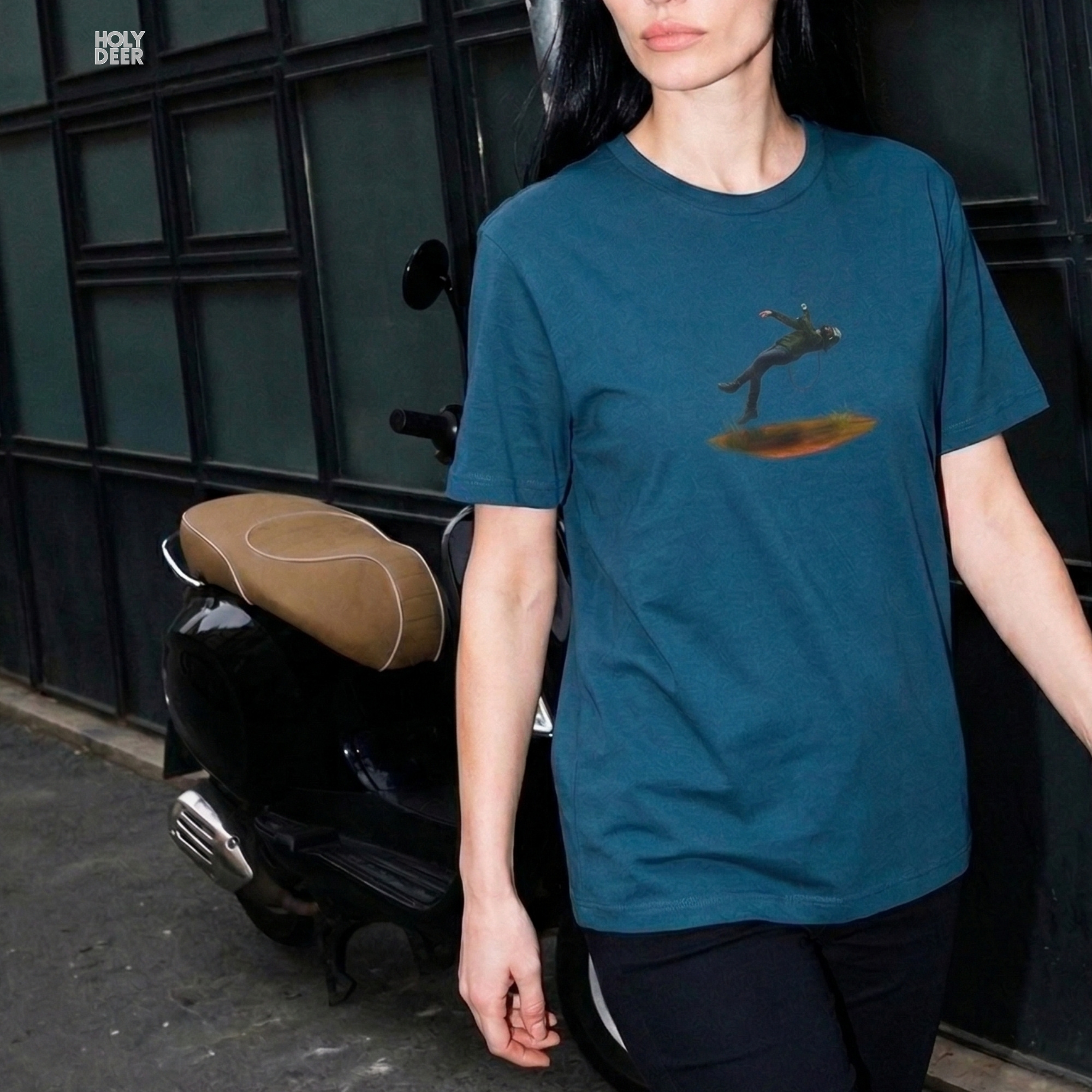 Minimalist dark backdrop focusing heavily on the standalone frame of the Techno Graphic Tee by Holydeer, proving it acts as a unique wearable art piece and an essential techno tshirt collectible.