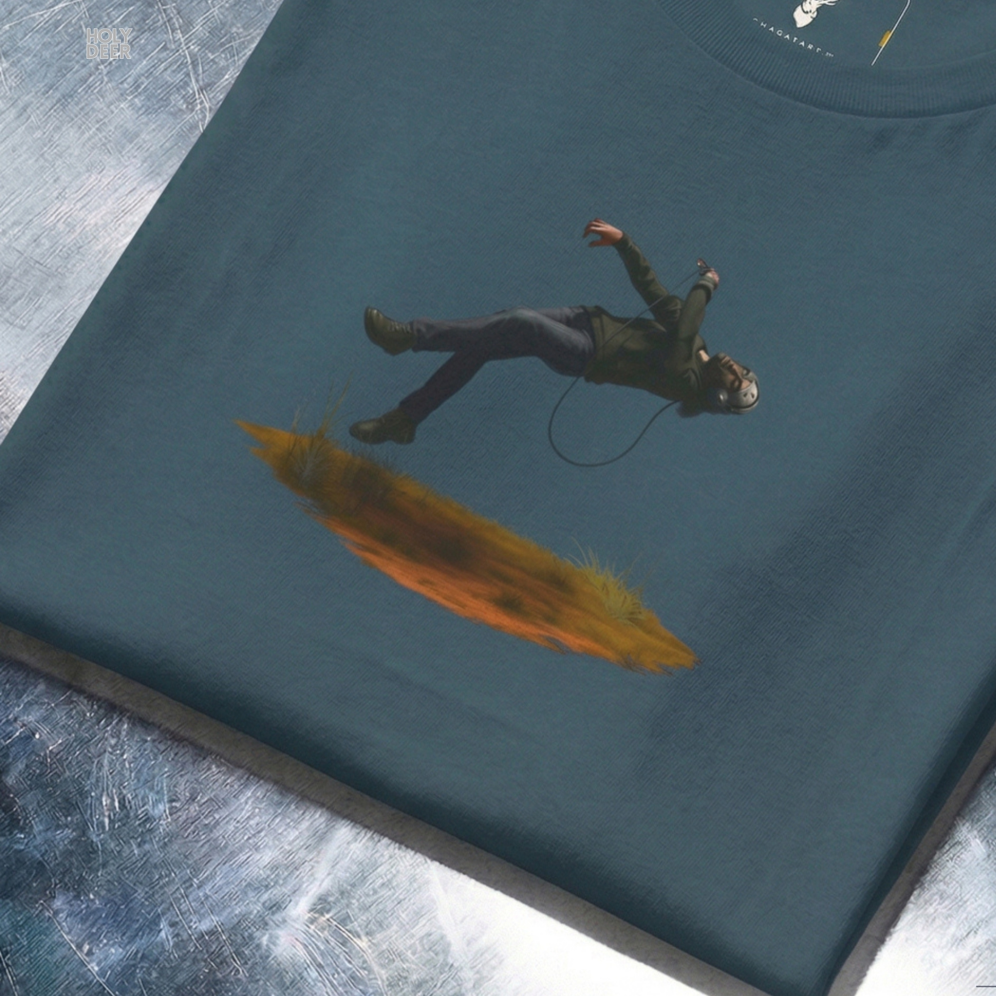 Angled perspective of the premium screen-printed Techno Graphic Tee, detailing the thick paint feel of the floating grass island element, centered layout placement, and the signature holydeer tee high-contrast design.