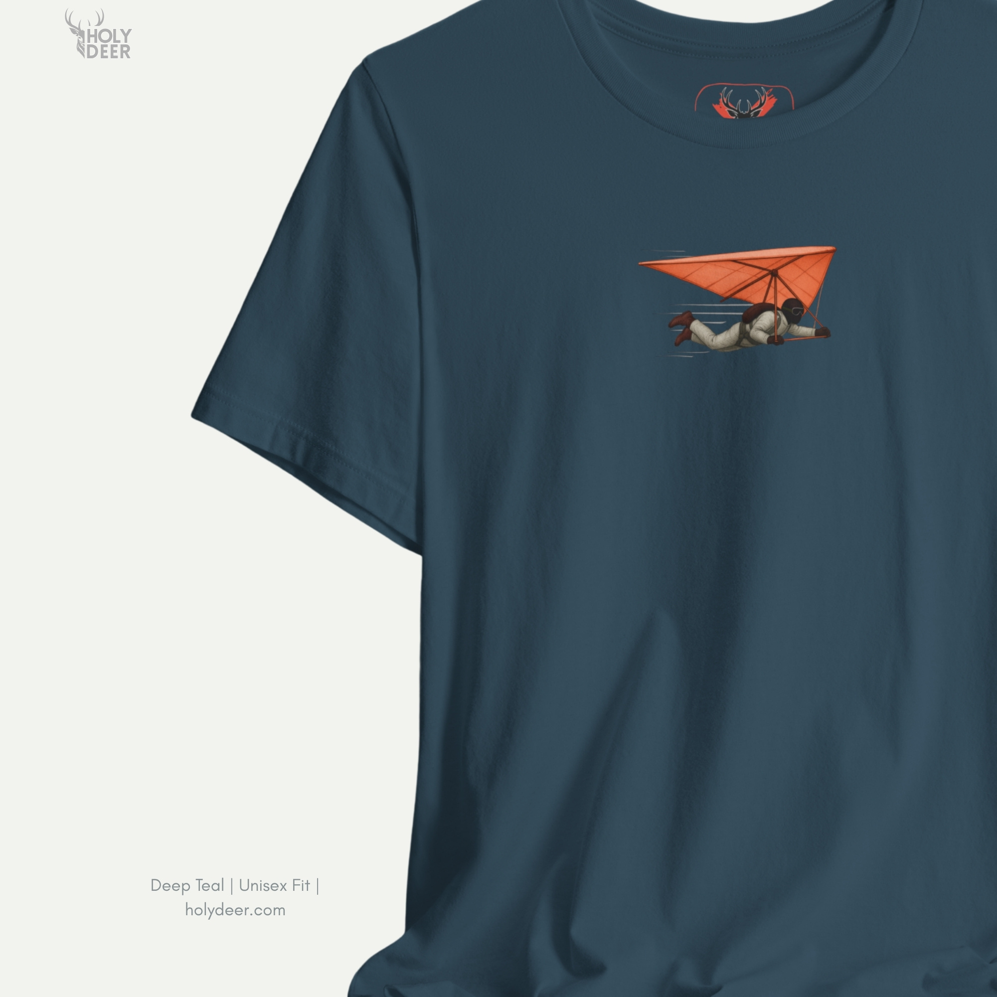 Angled perspective of the premium screen-printed Hang Glider Tee, detailing the thick paint feel of the pilot's protective helmet and flight harness lines, chest layout placement, and the signature holydeer tee high-contrast design.