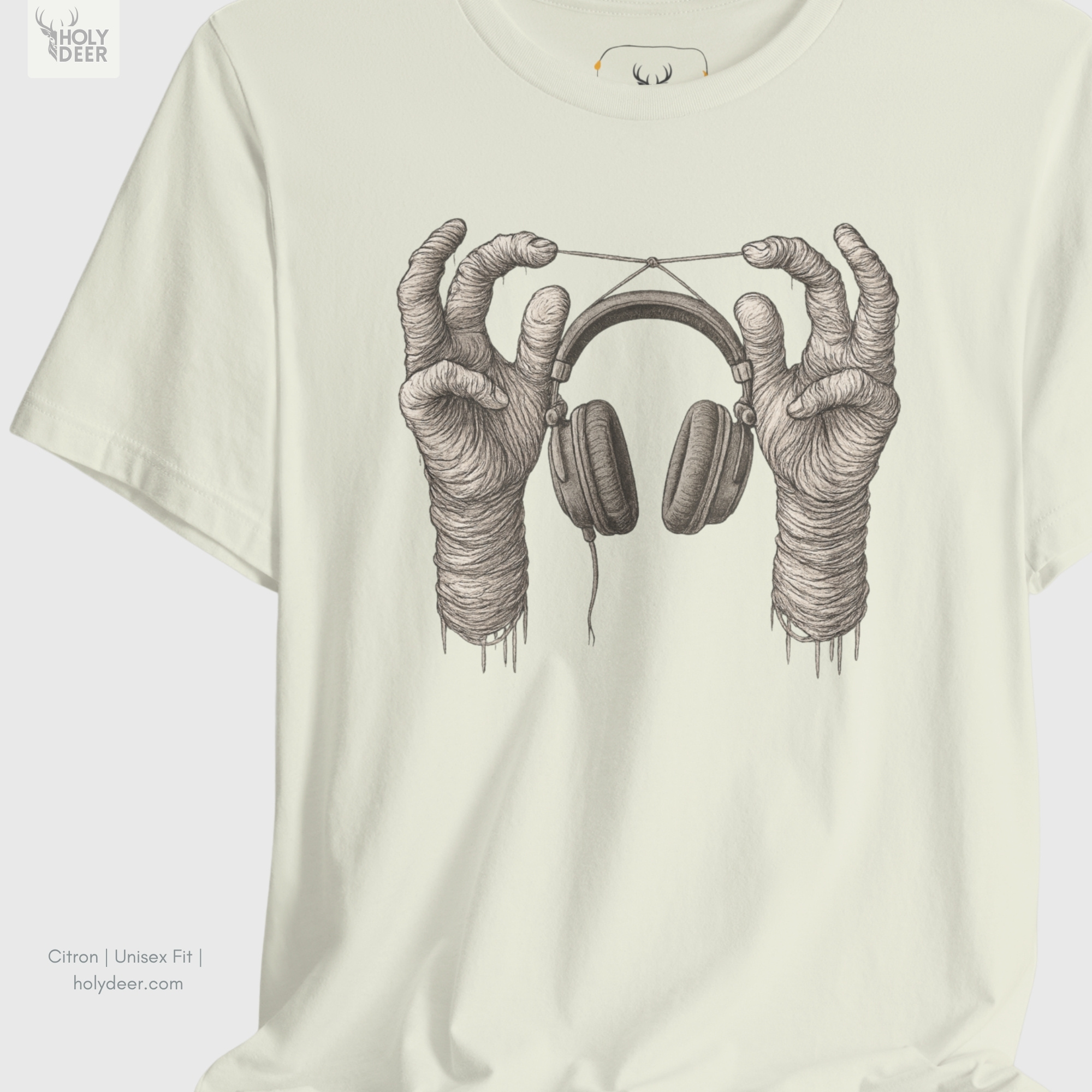 Angled perspective of the premium screen-printed Surreal Music Tee, detailing the thick paint feel of the suspended headphone headband and fine wire loops, center layout placement, and the signature holydeer tee high-contrast design.