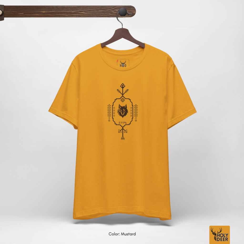 Overhead lookbook arrangement displaying the ethnic pattern tee folded neatly alongside weathered earth stones and oxidized ancient metallic artifacts.