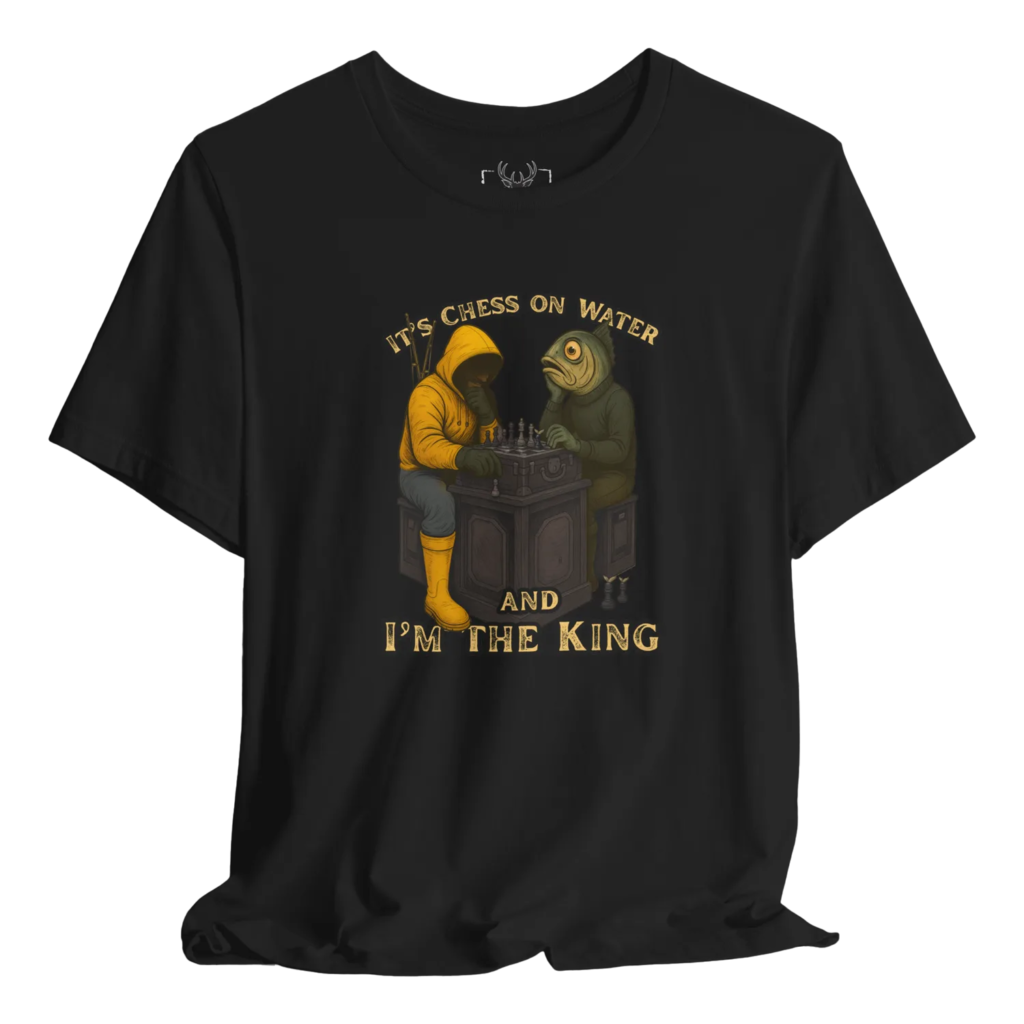 Teal fishing t shirt featuring a humorous illustration of a fisherman and a fish playing chess at a table with the quote “It’s chess on water and I’m the king”. Perfect for saltwater and freshwater anglers, boat fishermen, bass fishing lovers, outdoor sportsmen and anyone who enjoys clever fishing humor about strategy and skill on the water. Works great as streetwear or fishing trip apparel.