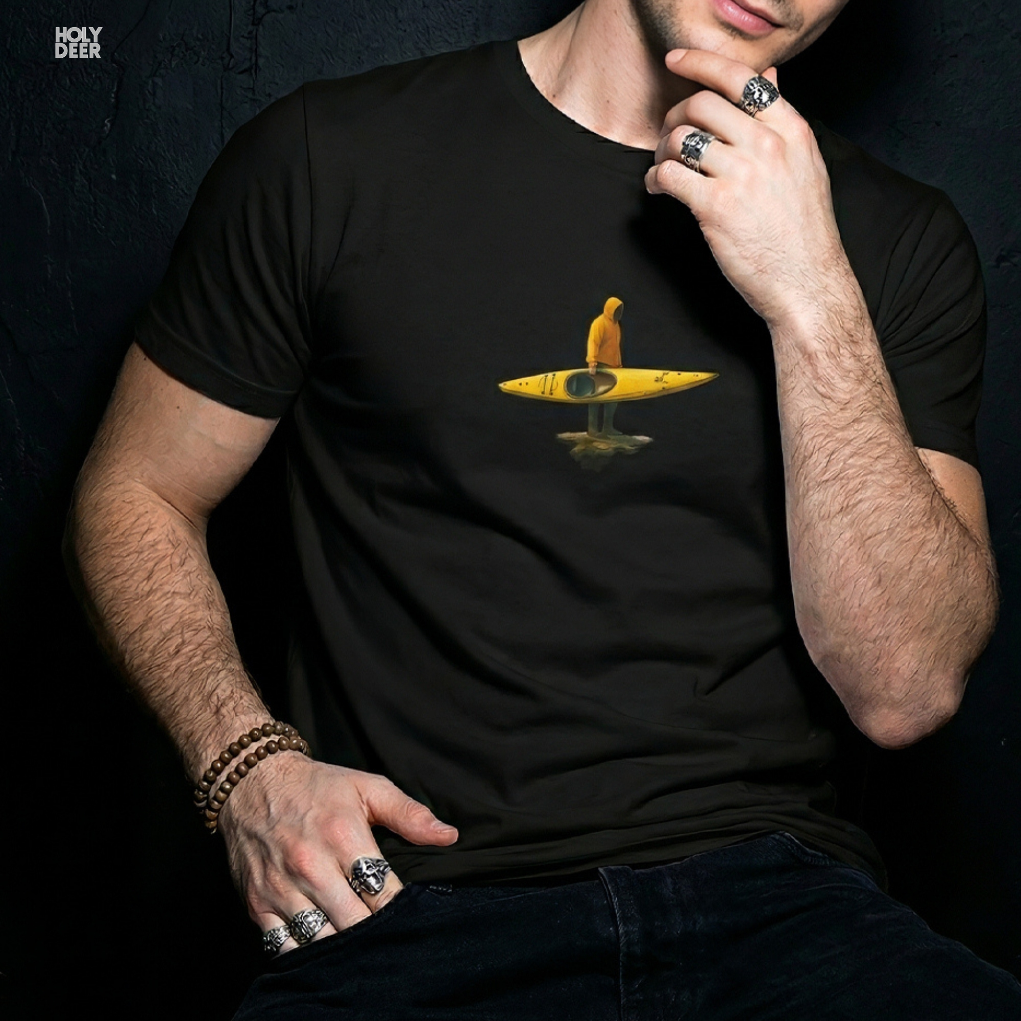 Professional flat lay photography of the River Adventure Tee by Holydeer Apparel, arranged cleanly next to minimalist mapping compasses and premium grade titanium carabiners.