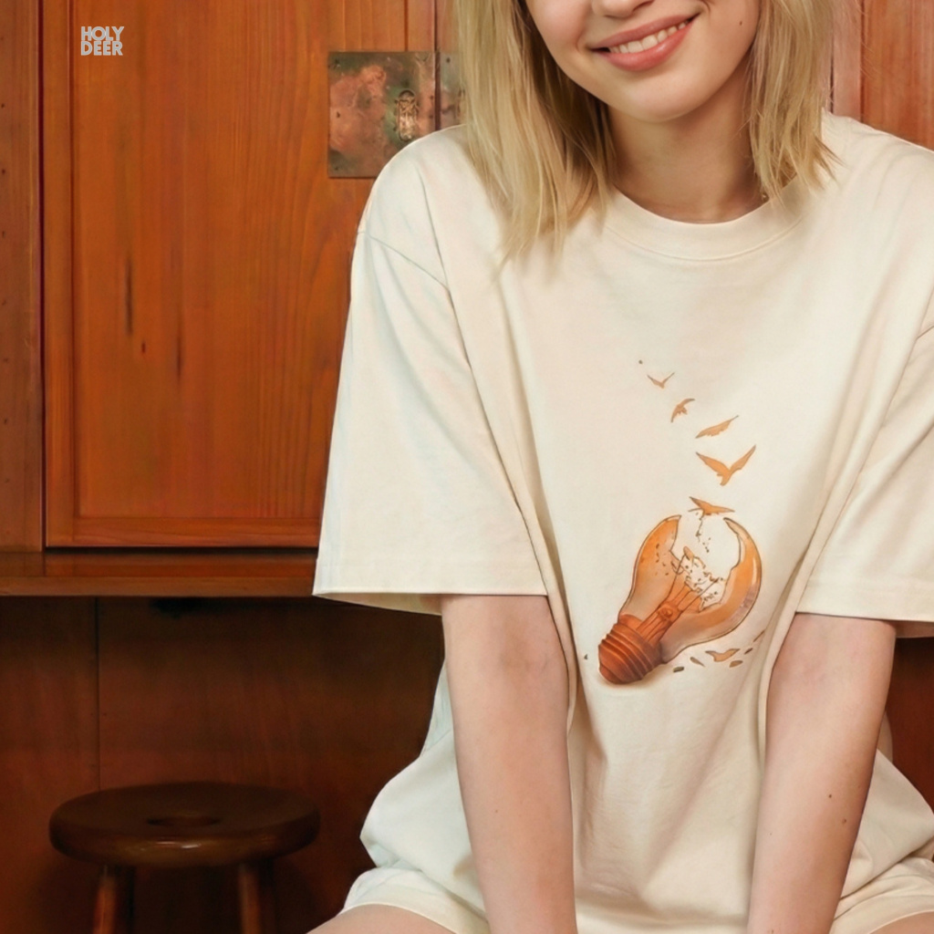 Minimalist dark backdrop focusing heavily on the standalone frame of the Freedom Tshirt by Holydeer, proving it acts as a unique wearable art piece and an essential think free shirt collectible.