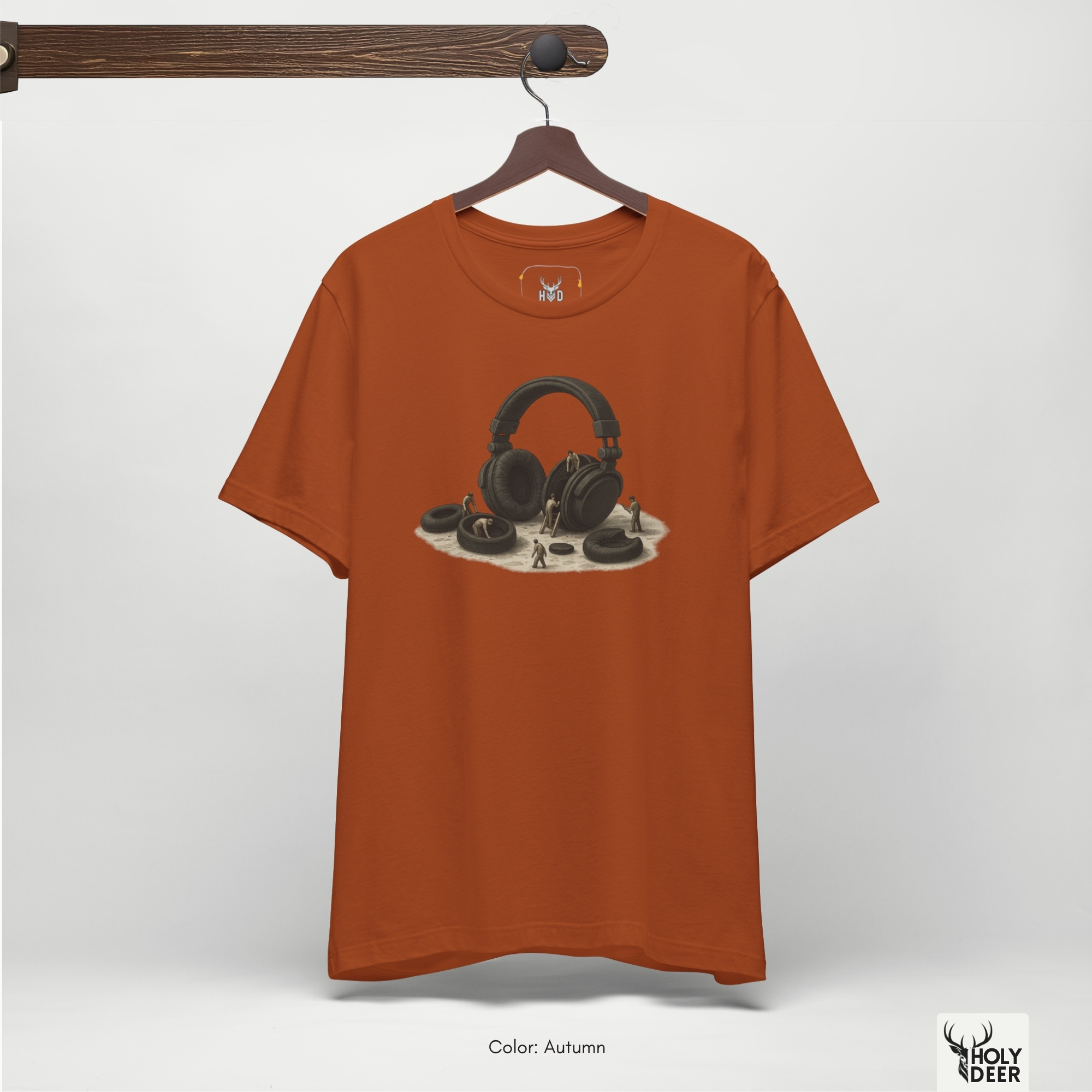 Overhead lookbook arrangement displaying the studio worker top folded neatly alongside thick braided audio connection lines and brown earth jasper specimens.