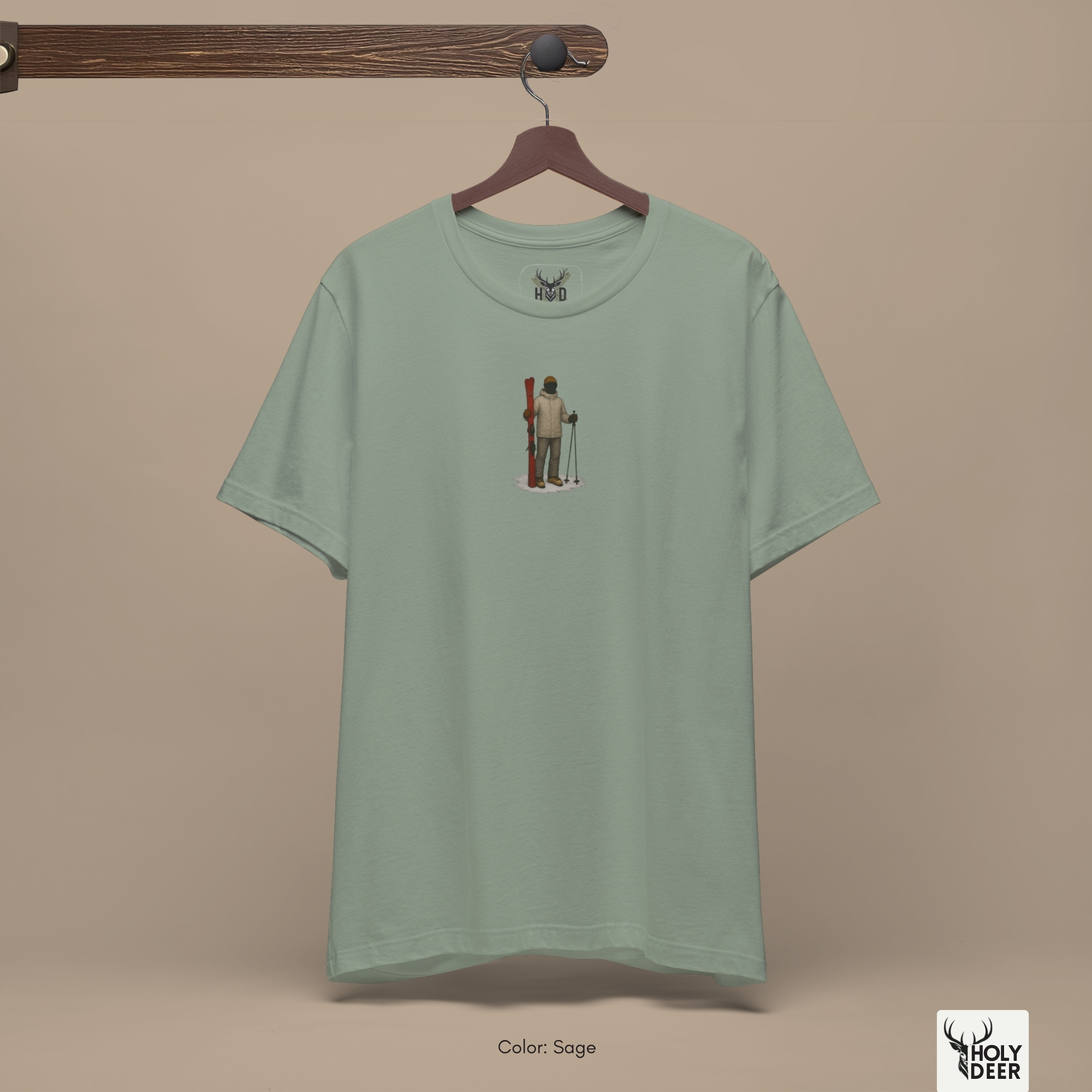 Angled perspective of the premium screen-printed Minimalist Ski Tee, detailing the thick paint feel of the tiny skier silhouette and vintage ski wear lines, centered chest placement, and the signature holydeer tee high-contrast design.