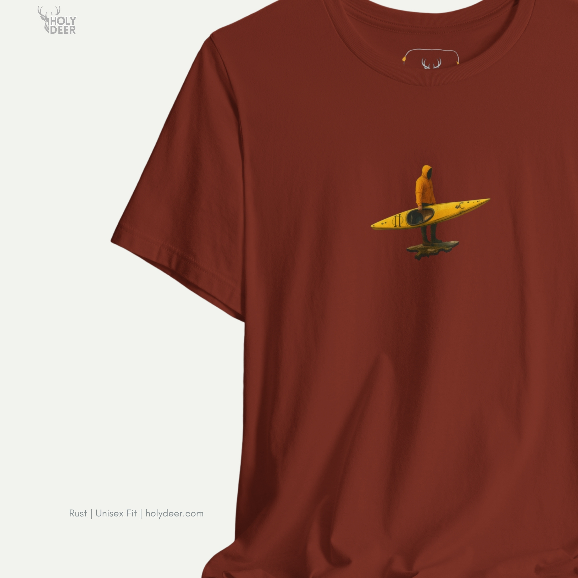 Angled perspective of the premium screen-printed River Adventure Tee, detailing the thick paint feel of the small rock pedestal element, centered placement, and the signature holydeer tee high-contrast layout.