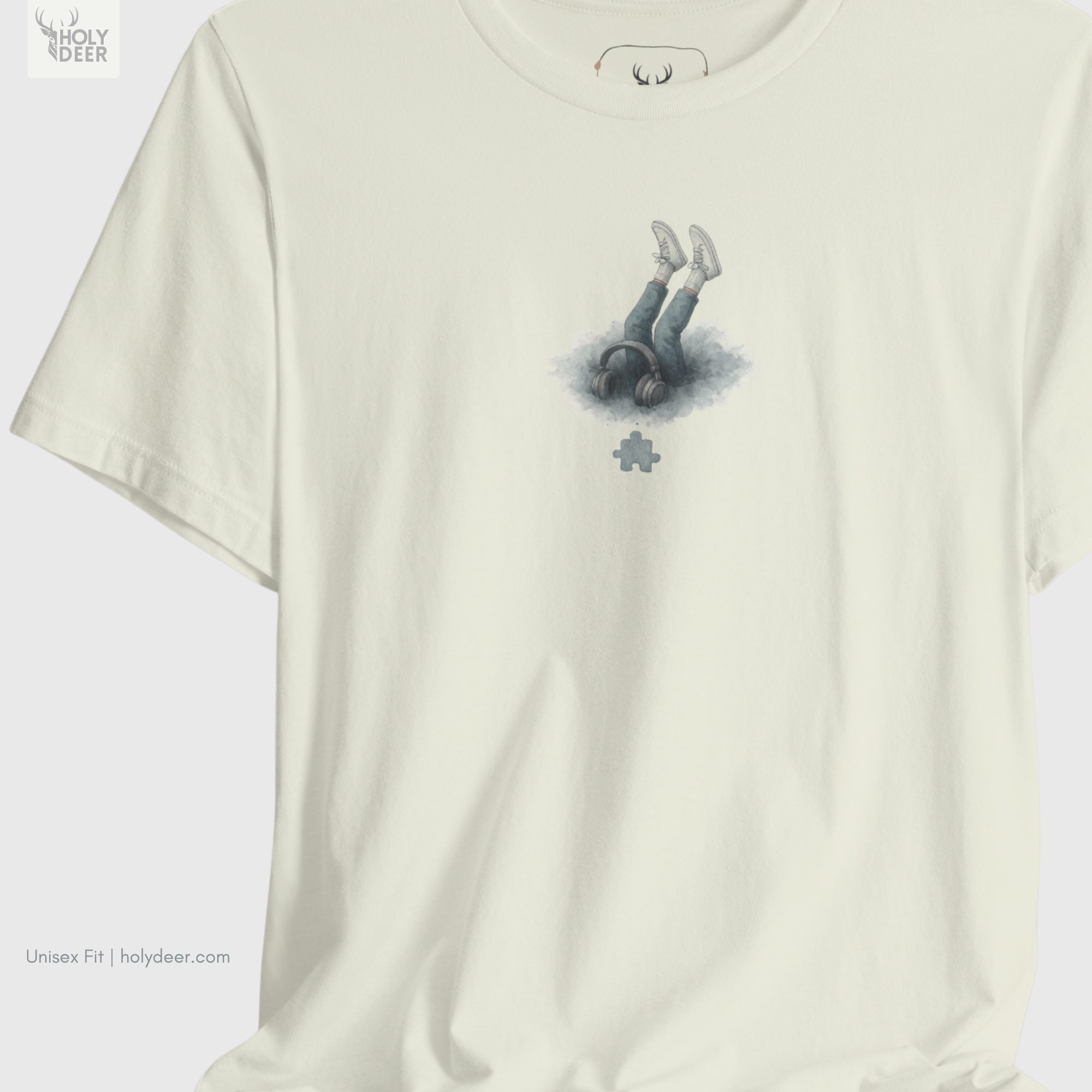 Angled perspective of the premium screen-printed Indie Musician Tee, detailing the thick paint feel of the watercolor audio cloud and individual puzzle piece art layout, chest placement, and the signature holydeer tee high-contrast design.