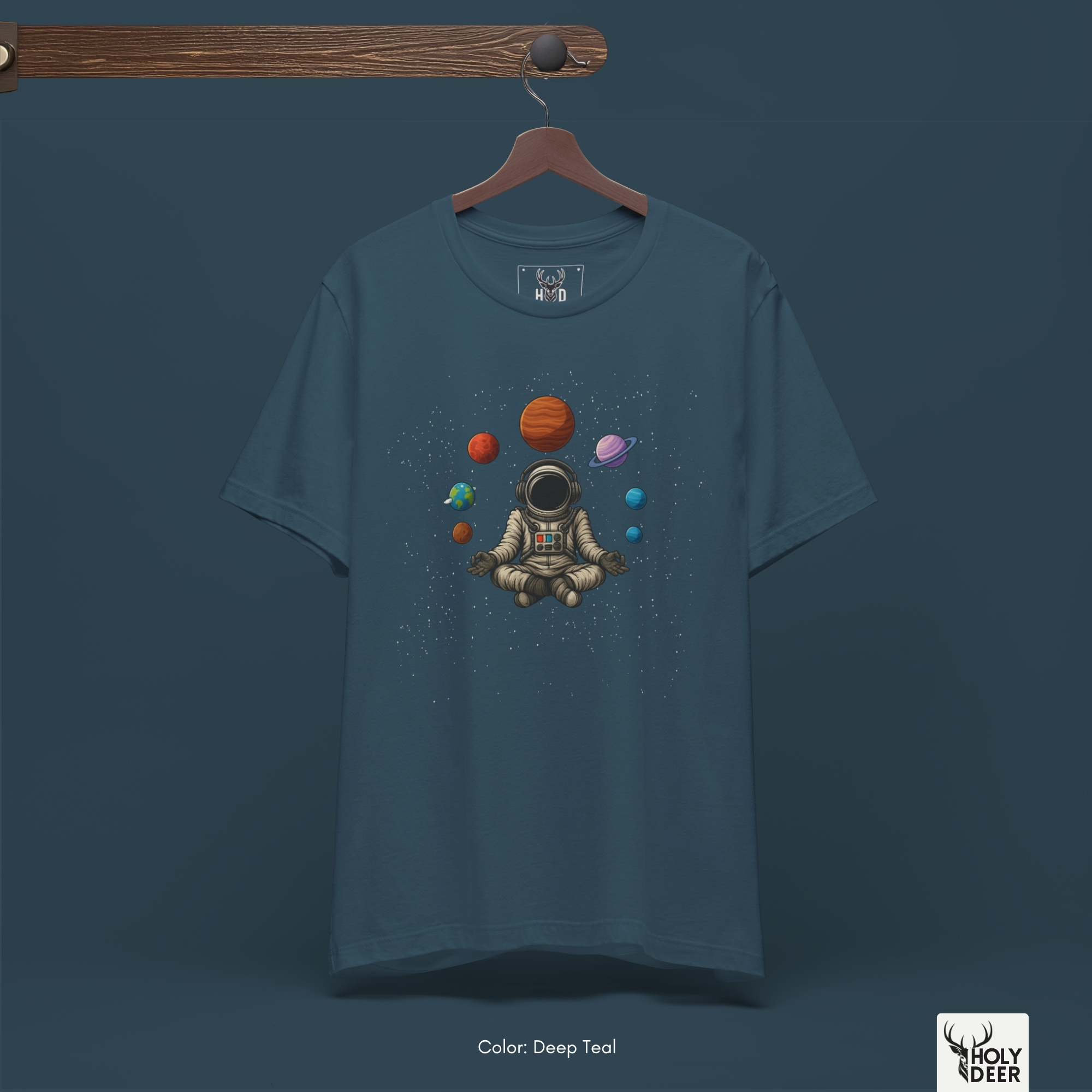 Professional flat lay photography of the Astronaut Meditate by Holydeer Apparel, arranged cleanly next to antique brass astrolabes, genuine meteorite stones, and cosmic planet graphic tee accessories.