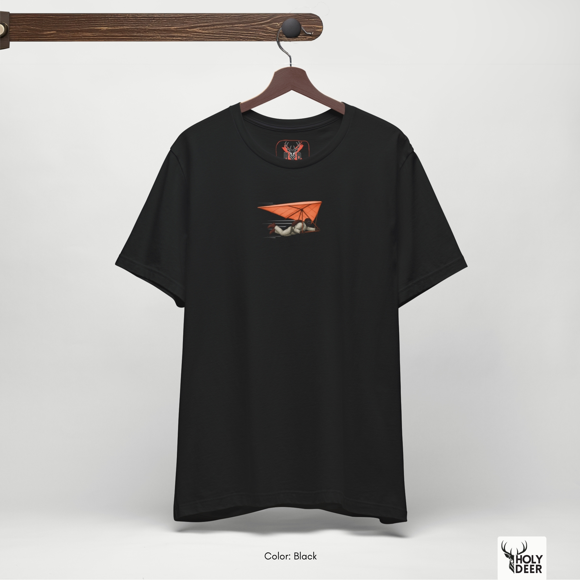 A candid industrial concrete underpass outdoor lifestyle photo featuring an extreme sports athlete wearing the official Hang Glider Tee by Holydeer Clothing, blending seamlessly into raw air sports shirt and dynamic air adventure tee settings.