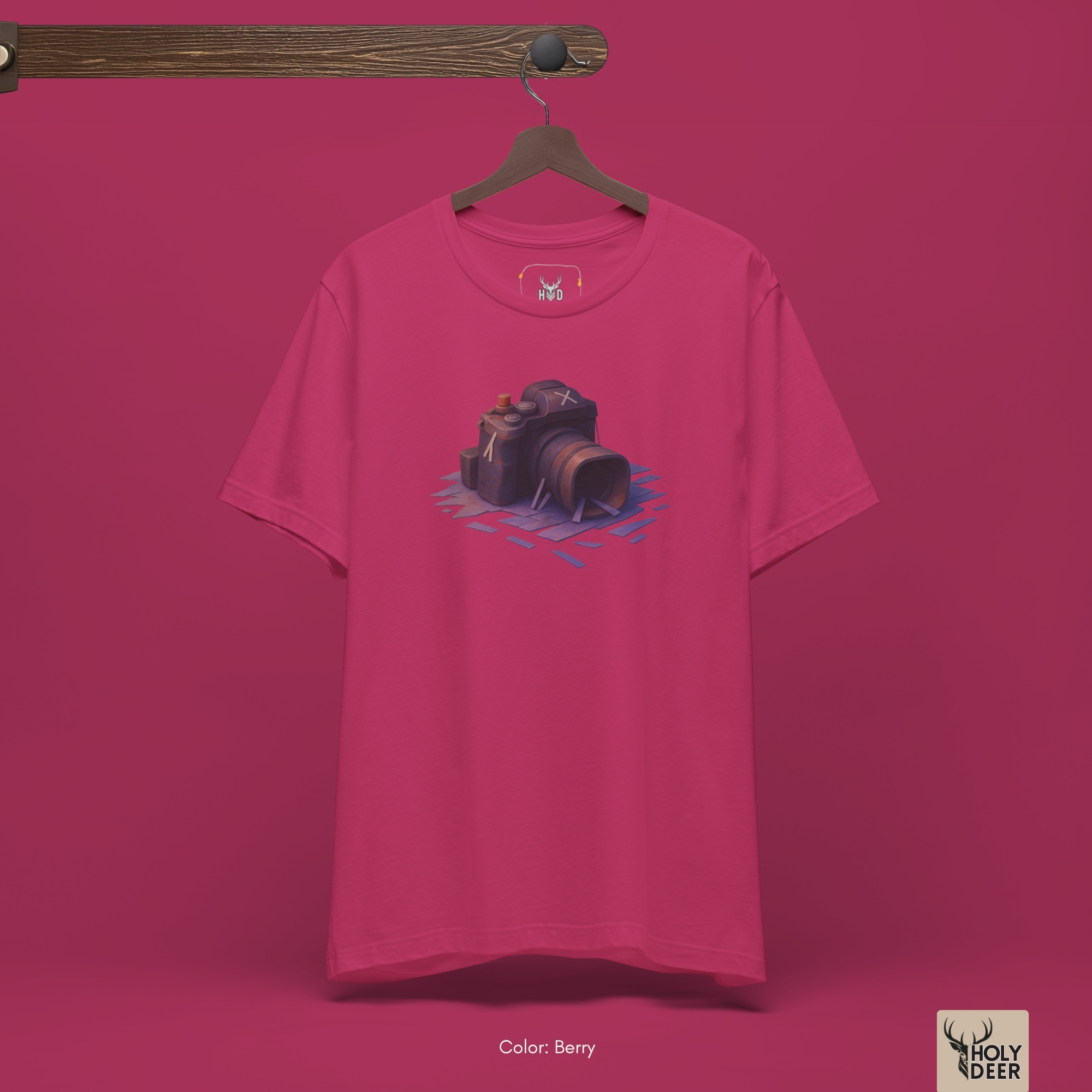 The iconic Photographer Shirt hanging cleanly on a luxury wood hanger, highlighting the robust neckline structure, crisp centered retro camera layout flow, and the official holydeer.com retail tags.