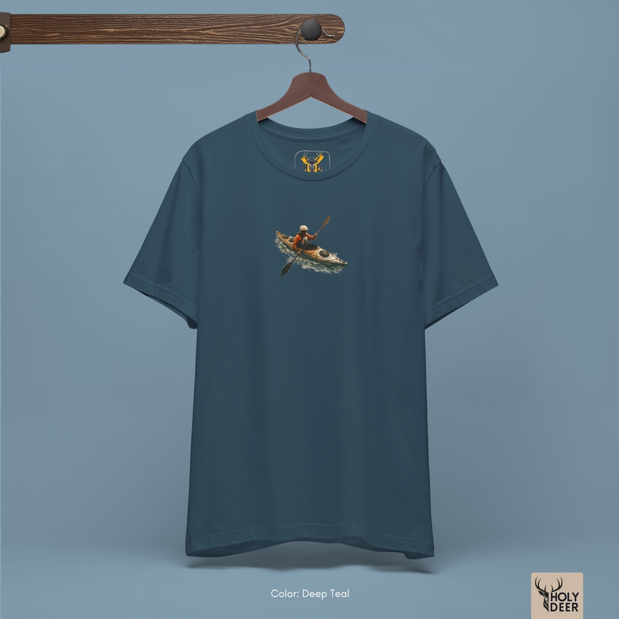 A candid canyon outdoor lifestyle photo featuring an adventure sports fan wearing the official Kayak Tee from Holydeer Clothing, blending seamlessly into raw indie creator wear and dynamic nature adventure environments.