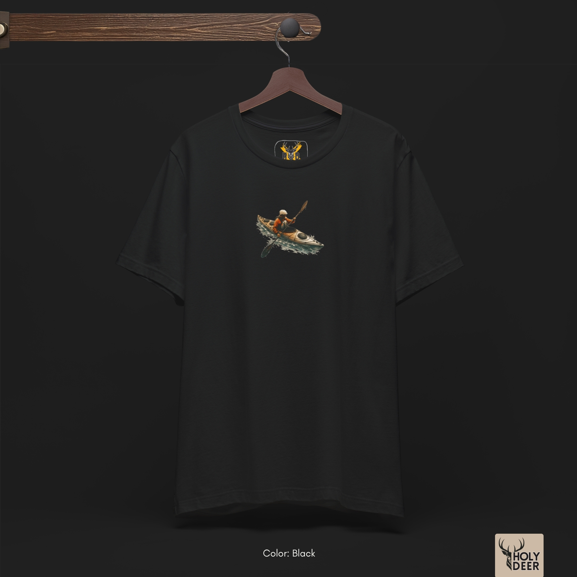 Angled perspective of the premium screen-printed Kayak Tee, detailing the thick orange and white paint feel, canoe graphic top alignment, and the signature holydeer tee high-contrast aesthetic sport art look.