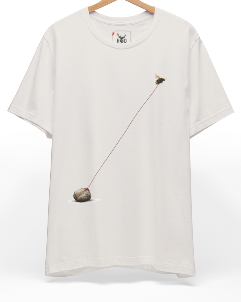 An overhead perspective displaying the bee-tshirt-minimalist-bee-tee-bee-graphic-tee-nature-tshirt-aesthetic.jpg artwork centered on a premium organic cotton backdrop by Holydeer Clothing.