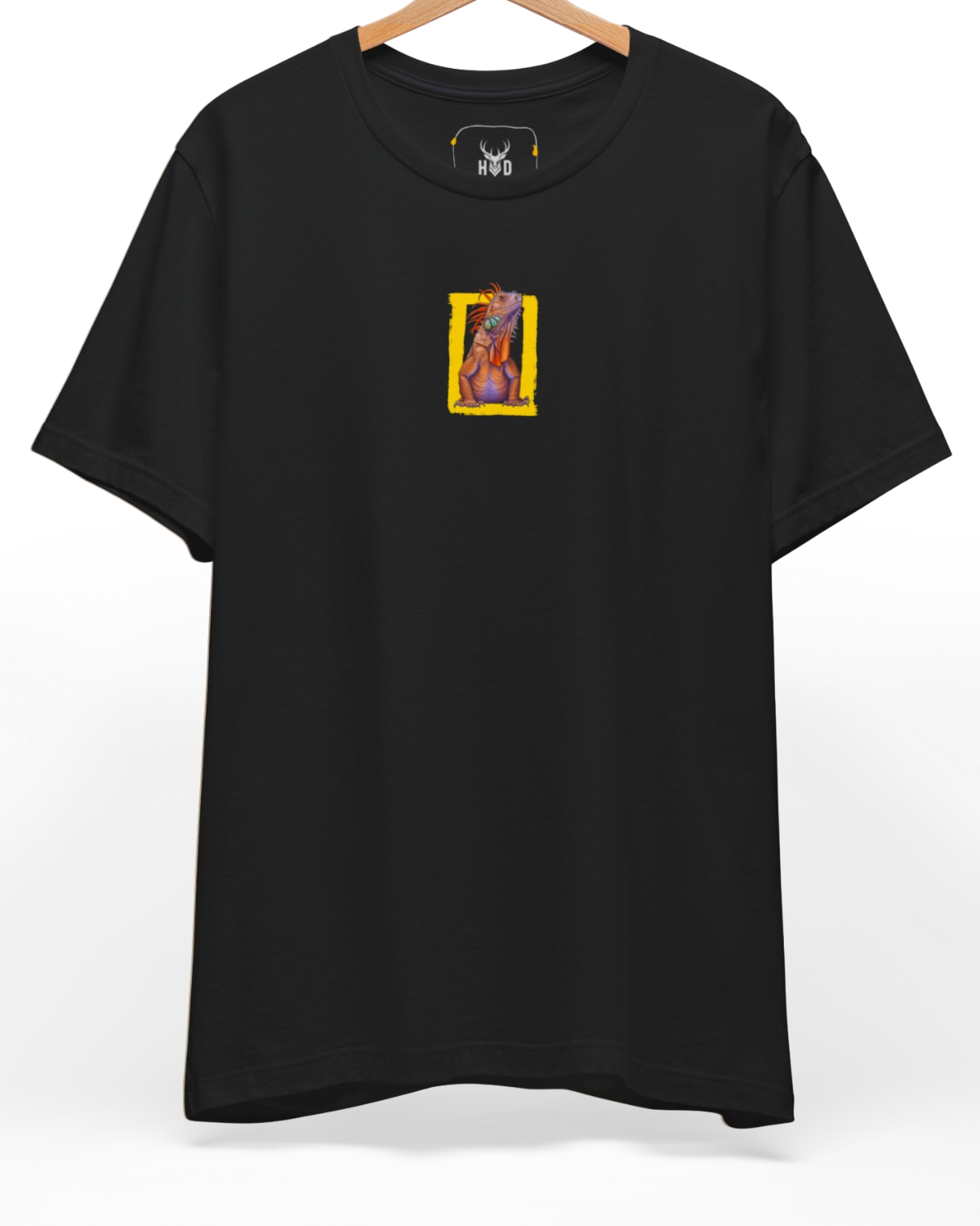 An eye-level studio presentation highlighting the modern-graphic-tee-nature-enthusiast-iguana-graphic-top-black-finish-holydeer-lifestyle.jpg artwork offset on a premium combed teal canvas by Holydeer Clothing.
