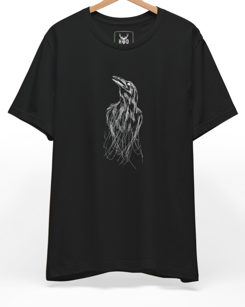 An eye-level studio presentation highlighting the sketchy-bird-top-design-modern-minimalist-gothic-tee-by-holydeer-exclusive-art-drop.jpg artwork aligned on the lower left of a premium combed black cotton canvas by Holydeer Clothing.
