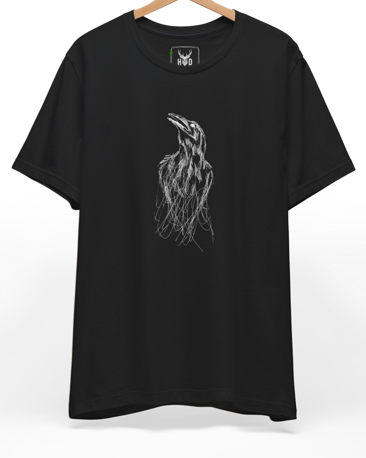 An eye-level studio presentation highlighting the sketchy-bird-top-design-modern-minimalist-gothic-tee-by-holydeer-exclusive-art-drop.jpg artwork aligned on the lower left of a premium combed black cotton canvas by Holydeer Clothing.