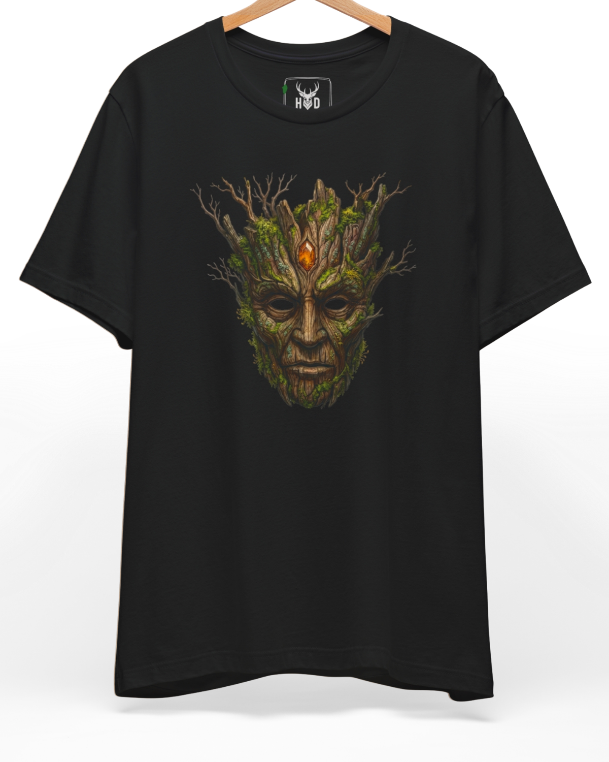 Centered showcase of the mythical-tree-art-design-modern-aesthetic-fantasy-tee-by-holydeer-exclusive-nature-drop.jpg art featuring a mossy wooden face printed on a heavy premium black Holydeer cotton shirt.
