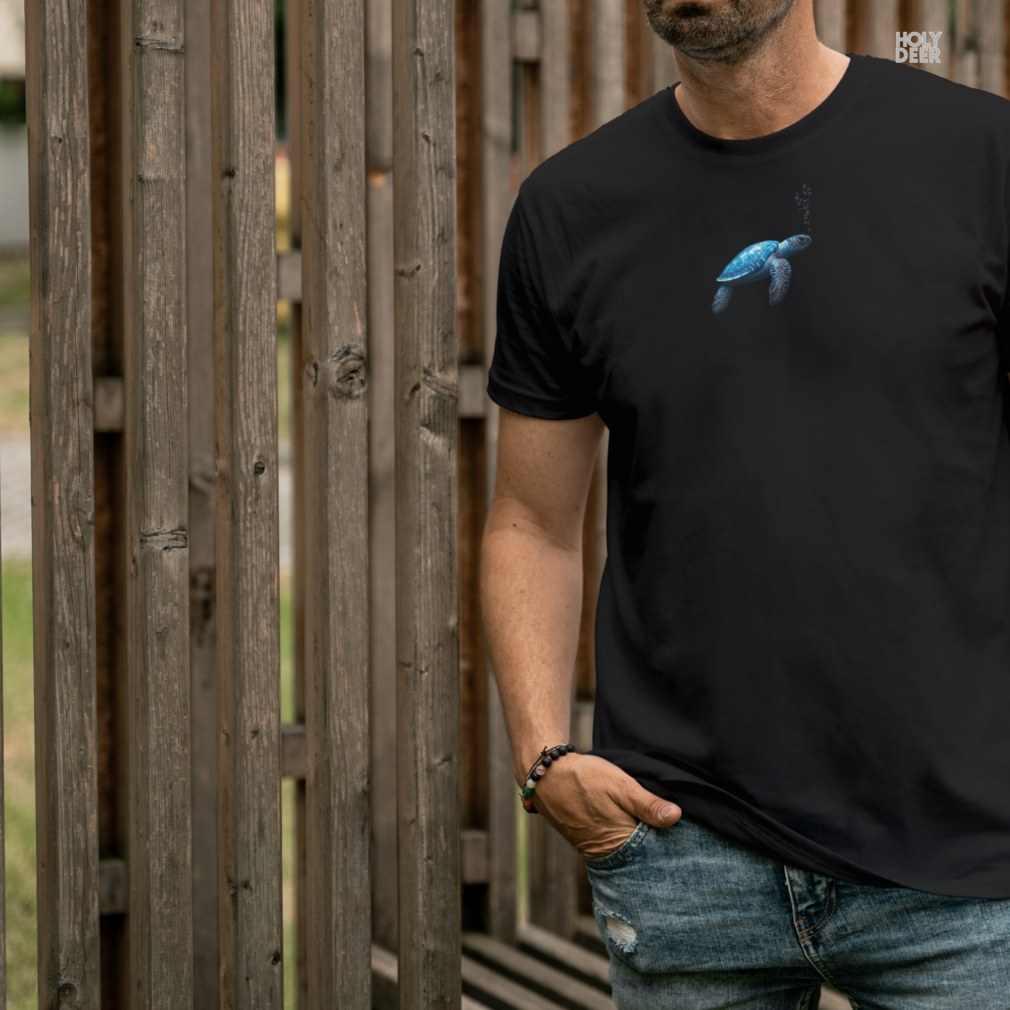 Technical close-up highlighting the stippled micro air bubble texture and the fine vertical ascent line guiding the gaze upwards on the ocean tshirt.
