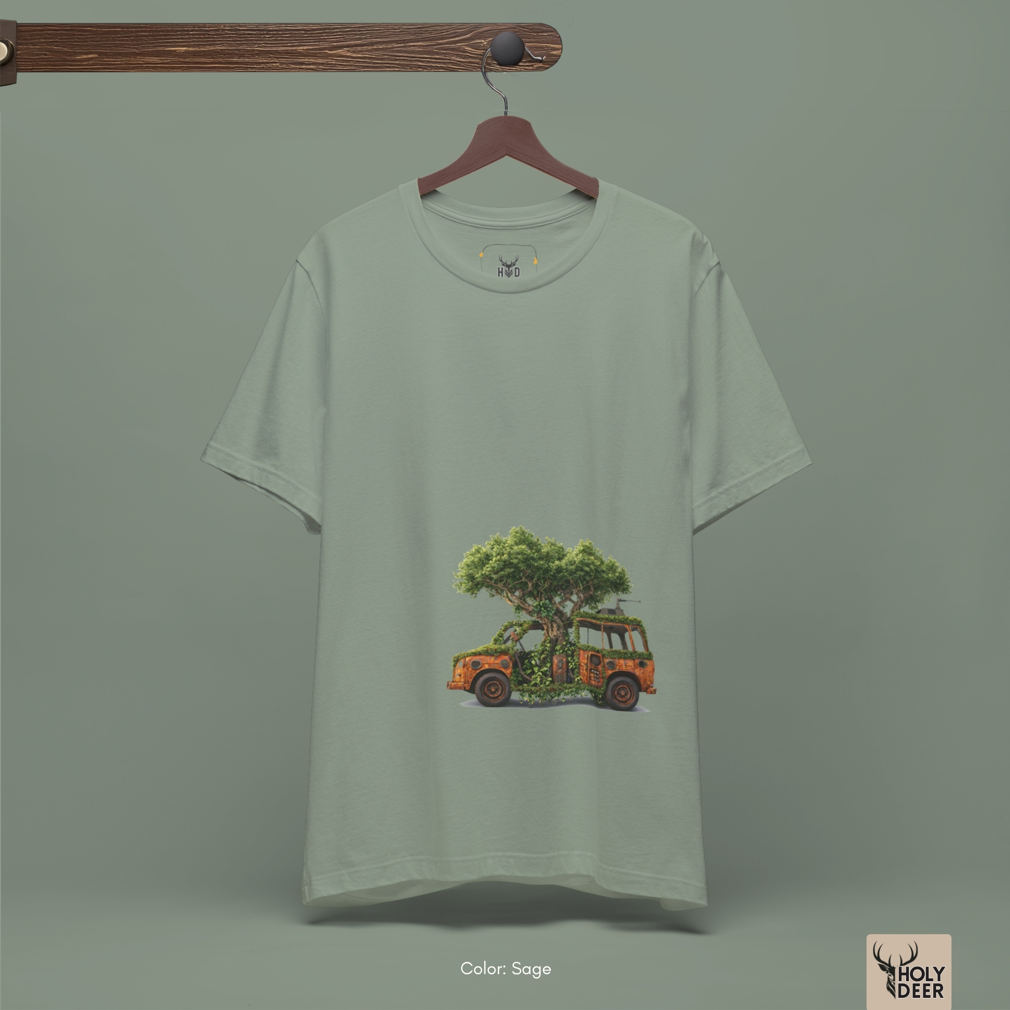 Macro view of the Nature Reclaim Tee print showcasing intricate ink shading on the rusted car steering column, flaking copper paint coats, and hyper-detailed forest green canopy leaves crafted exclusively by Holydeer Streetwear.