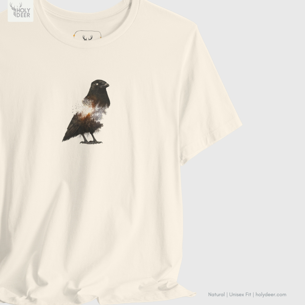 High-magnification print detail capturing the bright orange internal chest gradients, fine exploding embers, and high-intensity vector highlights of the dark crow tee.