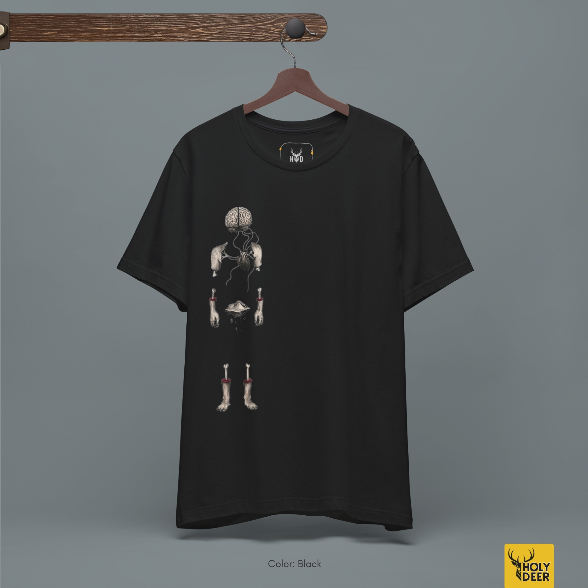 Brutalist concrete architecture studio outdoor lifestyle model wearing the off-centered Surreal Anatomy Tee from Holydeer Clothing, standing as a high-end abstract body tee statement matching elite dark anatomy tee trends.