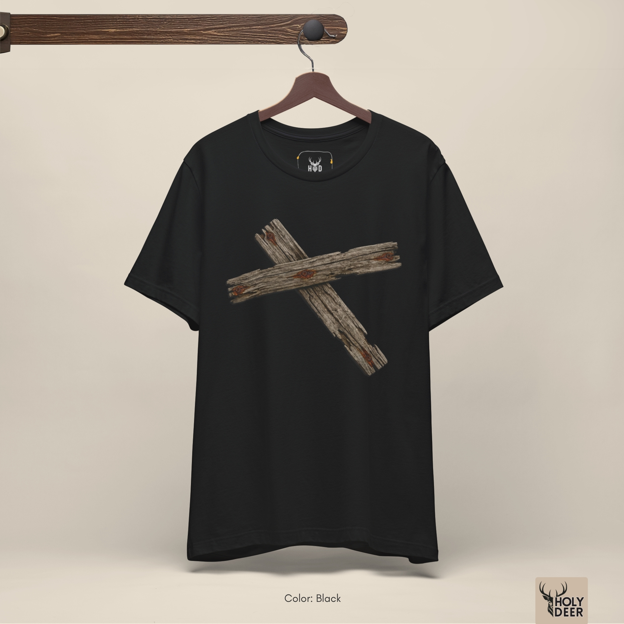 A candid industrial concrete underpass outdoor lifestyle photo featuring an independent creator wearing the official Wooden Cross Tshirt by Holydeer Clothing, blending seamlessly into raw unique cross shirt and dynamic wood texture tee settings.