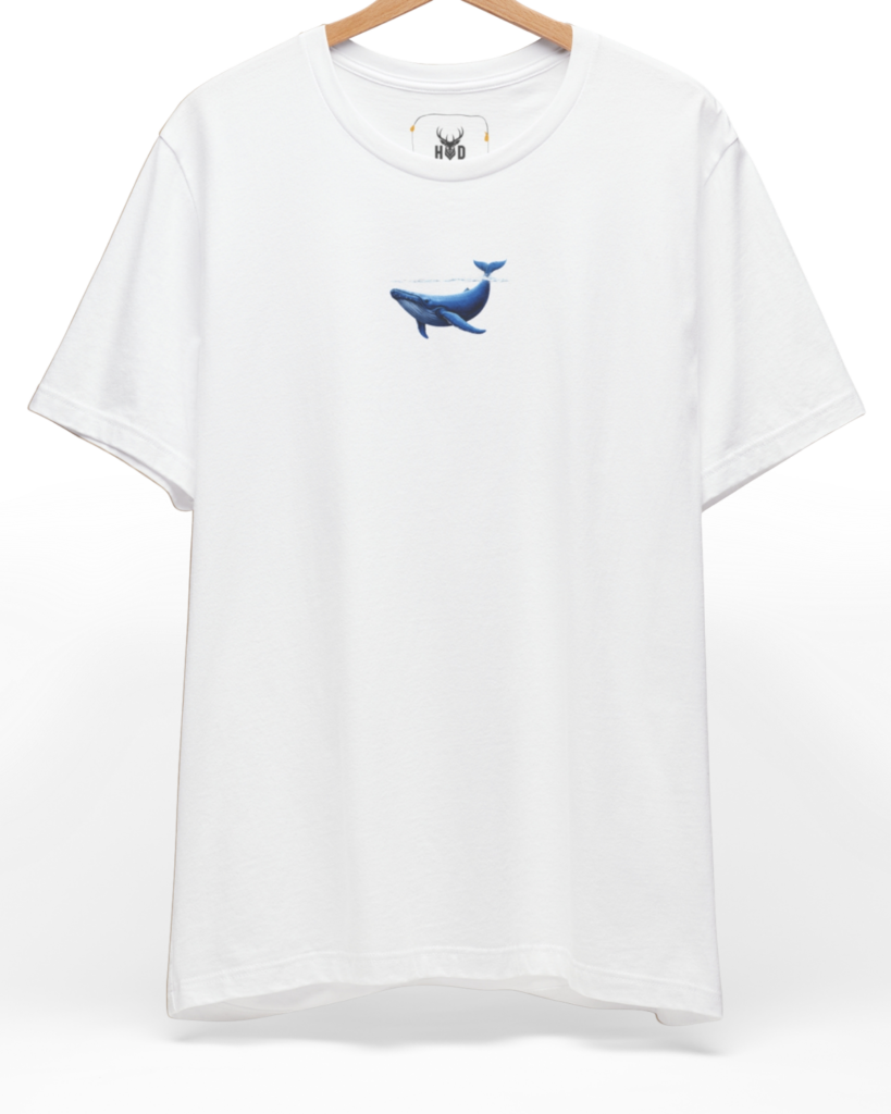 An eye-level studio presentation highlighting the calm-ocean-tee-blue-whale-surface-minimal-design-underwater-visual-holydeer-style.jpg artwork aligned on the upper left chest of a premium combed black cotton canvas by Holydeer Clothing.
