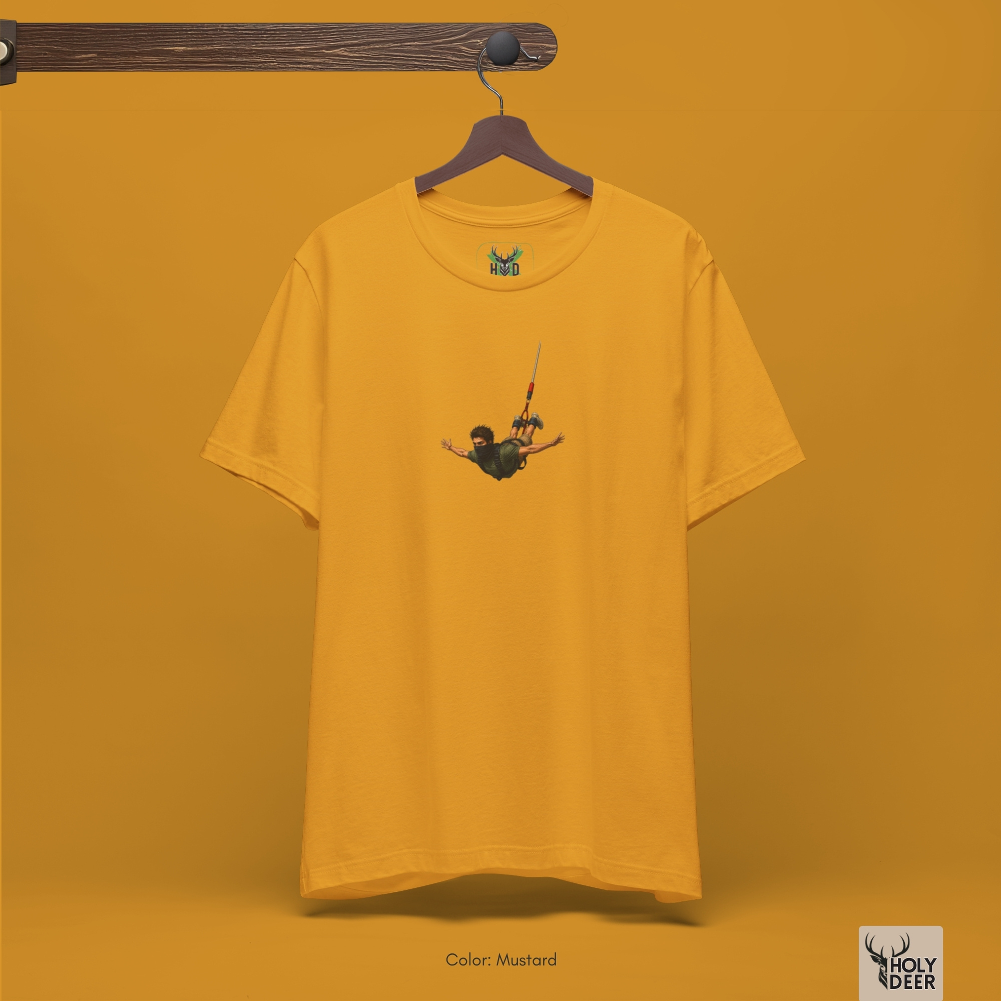 Dark shadow studio backdrop framing the unique Bungee Jumping Tee by Holydeer Streetwear, magnifying the clean off-centered bungee jump shirt placement and premium free fall art tee presentation.