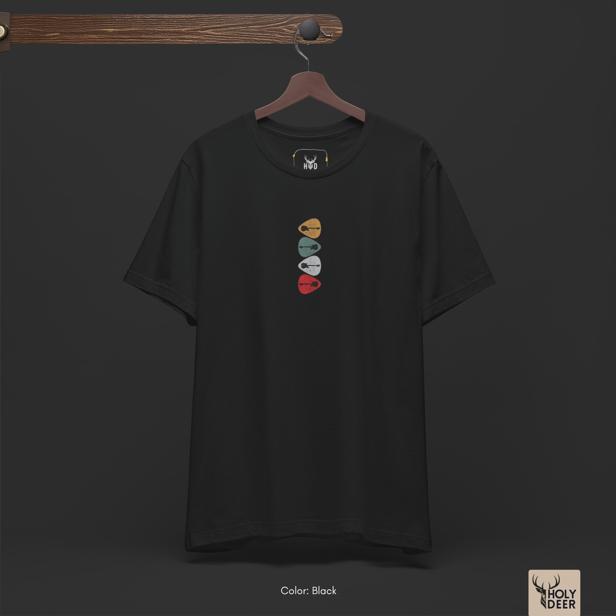 Minimalist dark backdrop focusing heavily on the standalone frame of the Retro Guitar Shirt by Holydeer, proving it acts as a unique wearable art piece and an essential black graphic tee collectible.