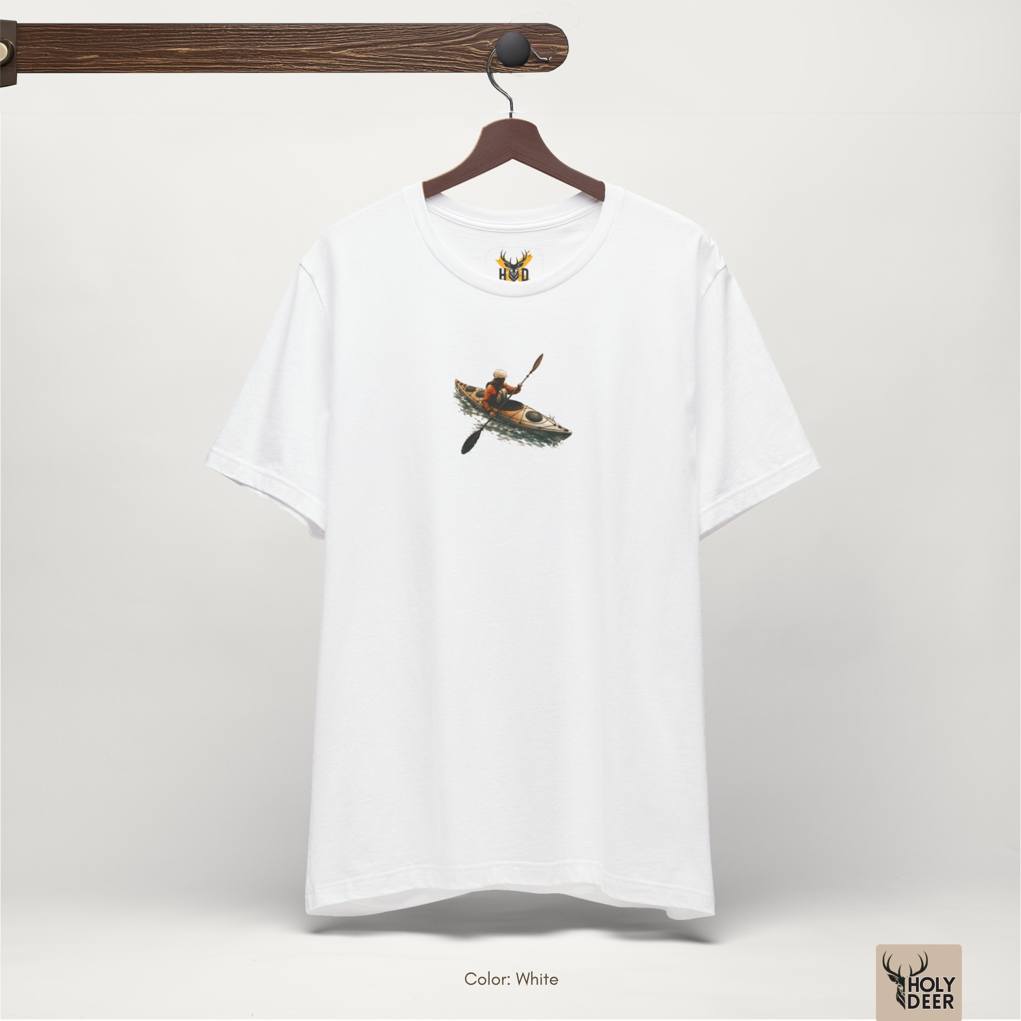 Soft shadow studio backdrop framing the unique Kayak Tee by Holydeer Streetwear, magnifying the clean centered canoe graphic top placement and premium nature adventure presentation.