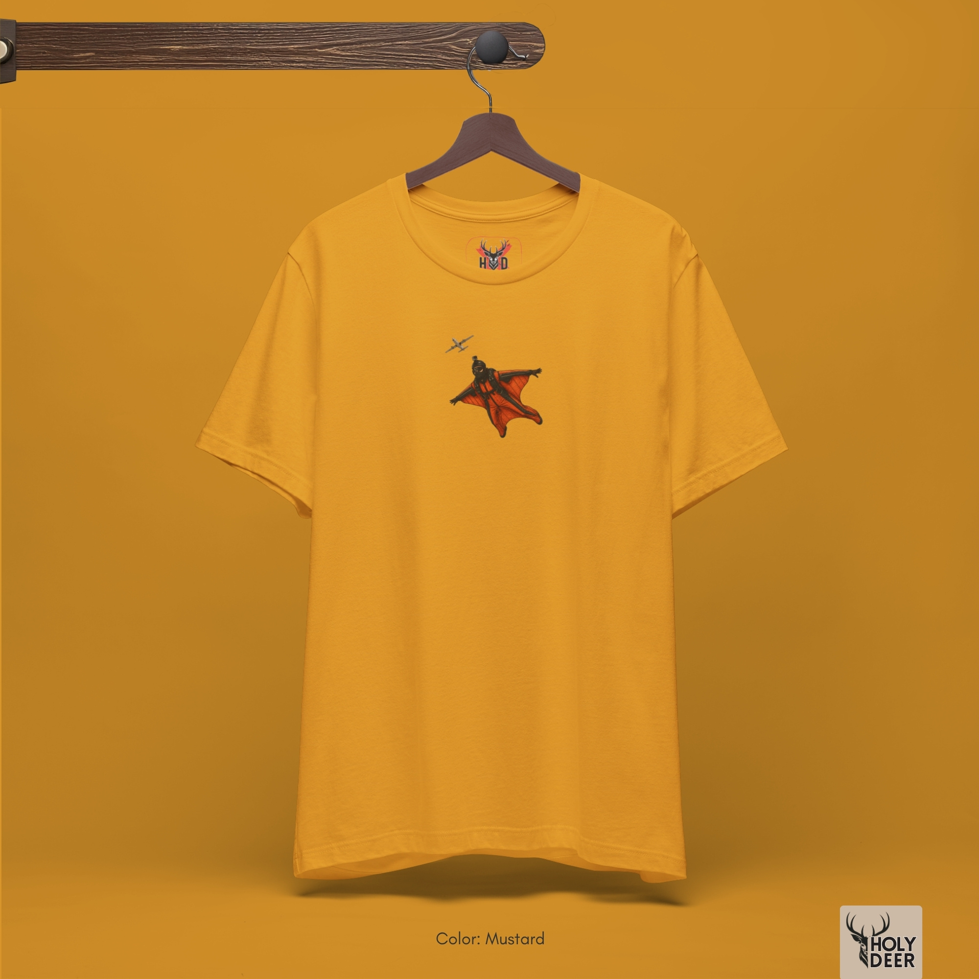 Angled perspective of the premium screen-printed Wingsuit Pilot Tee, detailing the thick yellow paint feel, base jumper shirt alignment, and the signature holydeer tee high-contrast minimalist flight look.