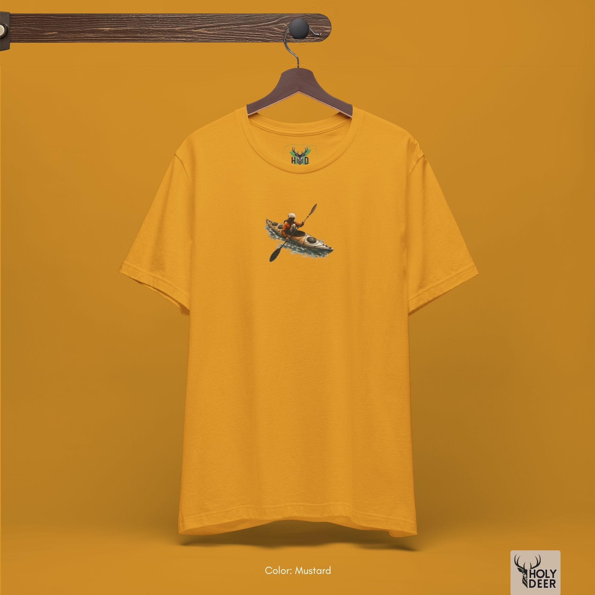 Professional flat lay photography of the Kayak Tee by Holydeer Apparel, arranged elegantly next to premium kayaker gift items and high-end wild water apparel blueprints.
