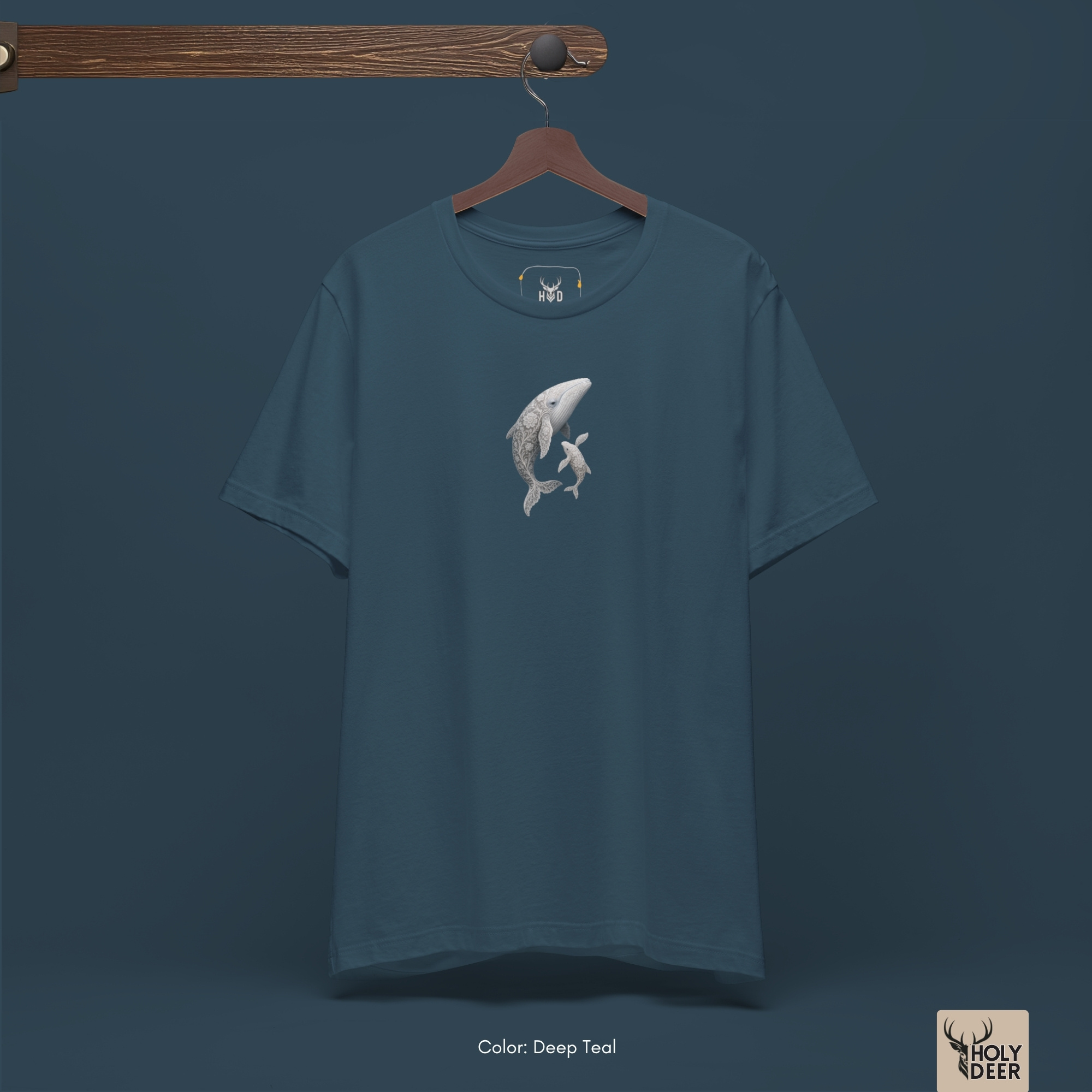 A macro perspective tracking the soft grey ink gradients and smooth linear paths forming the throat grooves of the primary mammal on the whale t-shirt.