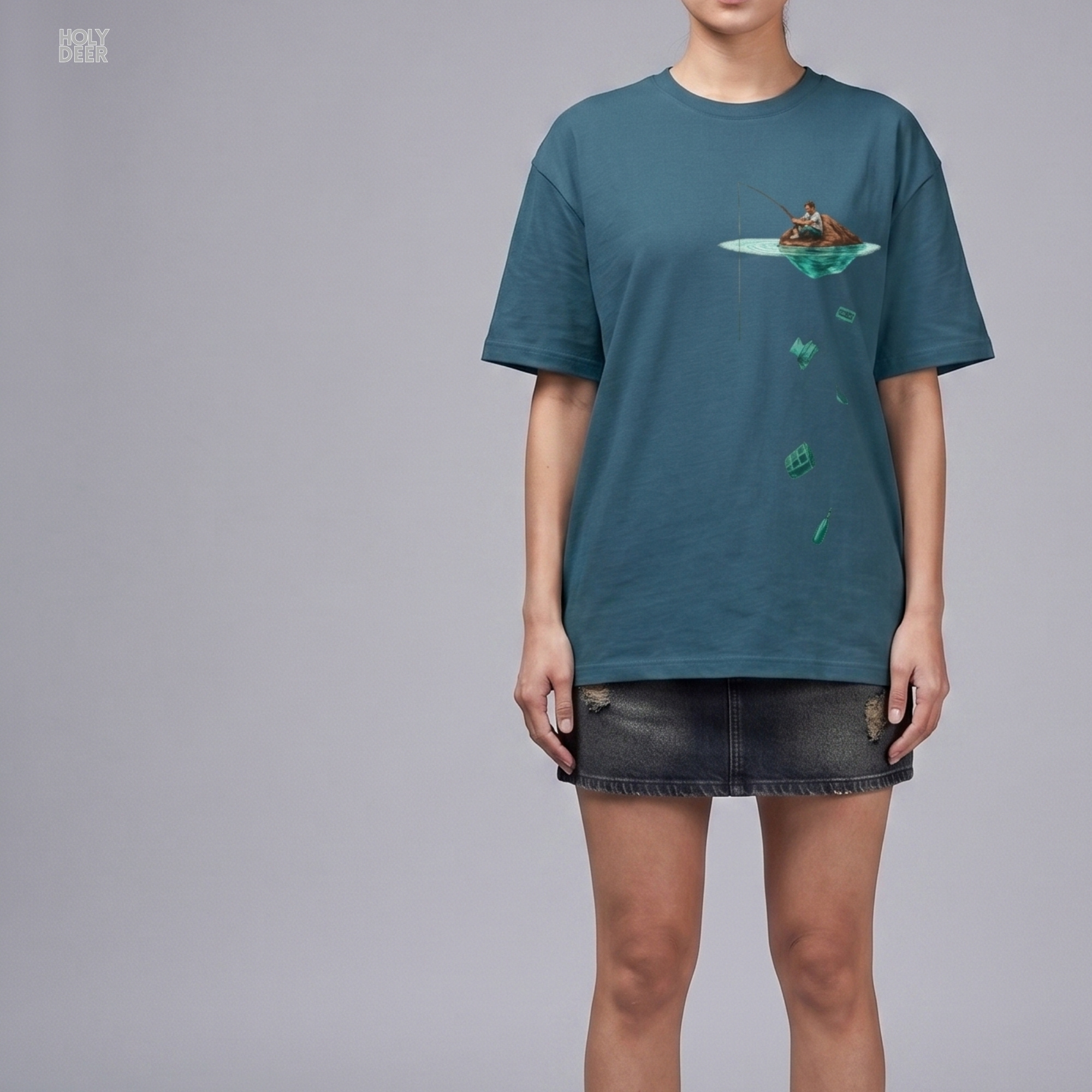 Professional flat lay photography of the Surreal Fishing Tee by Holydeer Apparel, arranged cleanly next to nostalgic plastic cassette tapes, waterlogged antique literature pages, and silent catch tee lifestyle essentials.