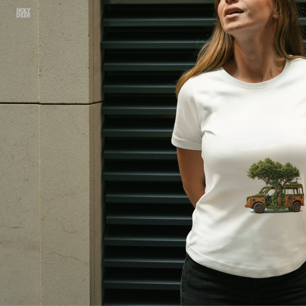 Modern brutalist industrial abandoned warehouse concrete architecture outdoor lifestyle model wearing the centered Nature Reclaim Tee from Holydeer Clothing, standing as a forest takeover tee statement matching elite poetic nature tee trends.