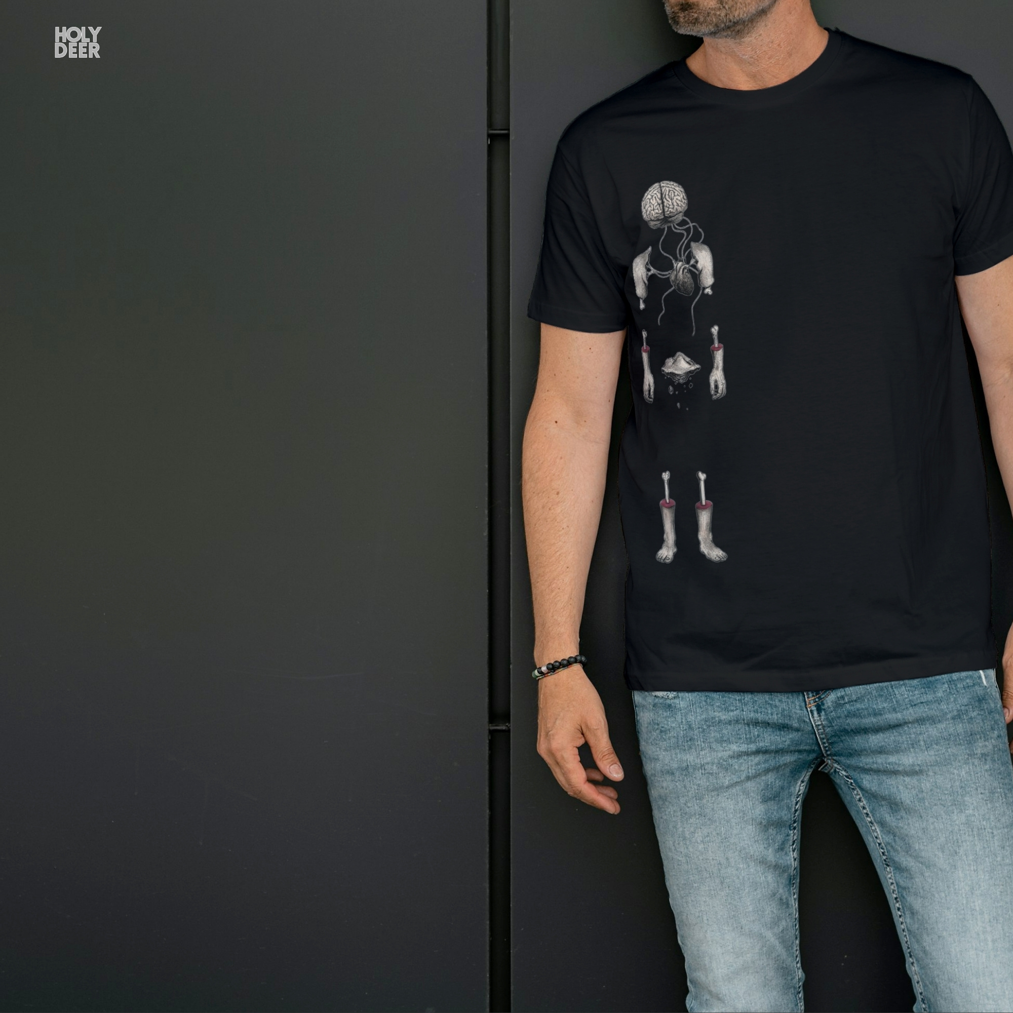 Minimalist dark backdrop focusing heavily on the standalone frame of the Surreal Anatomy Tee by Holydeer, proving it acts as a unique wearable art piece and an essential abstract body tee collectible.