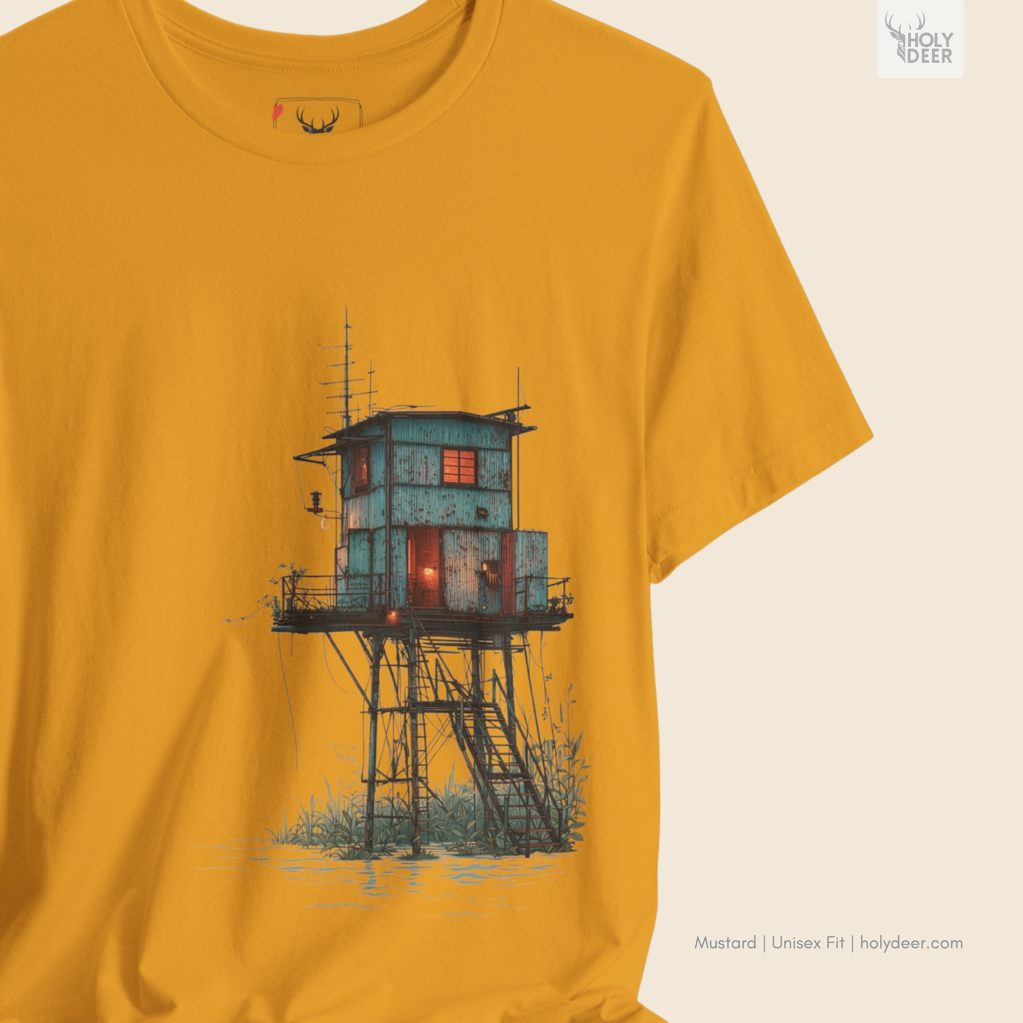 Angled perspective of the premium screen-printed Surreal Coastal Watchtower Shirt, detailing the thick paint feel of the metal stilts and marsh reeds element, centered placement, and the signature holydeer tee high-contrast layout.