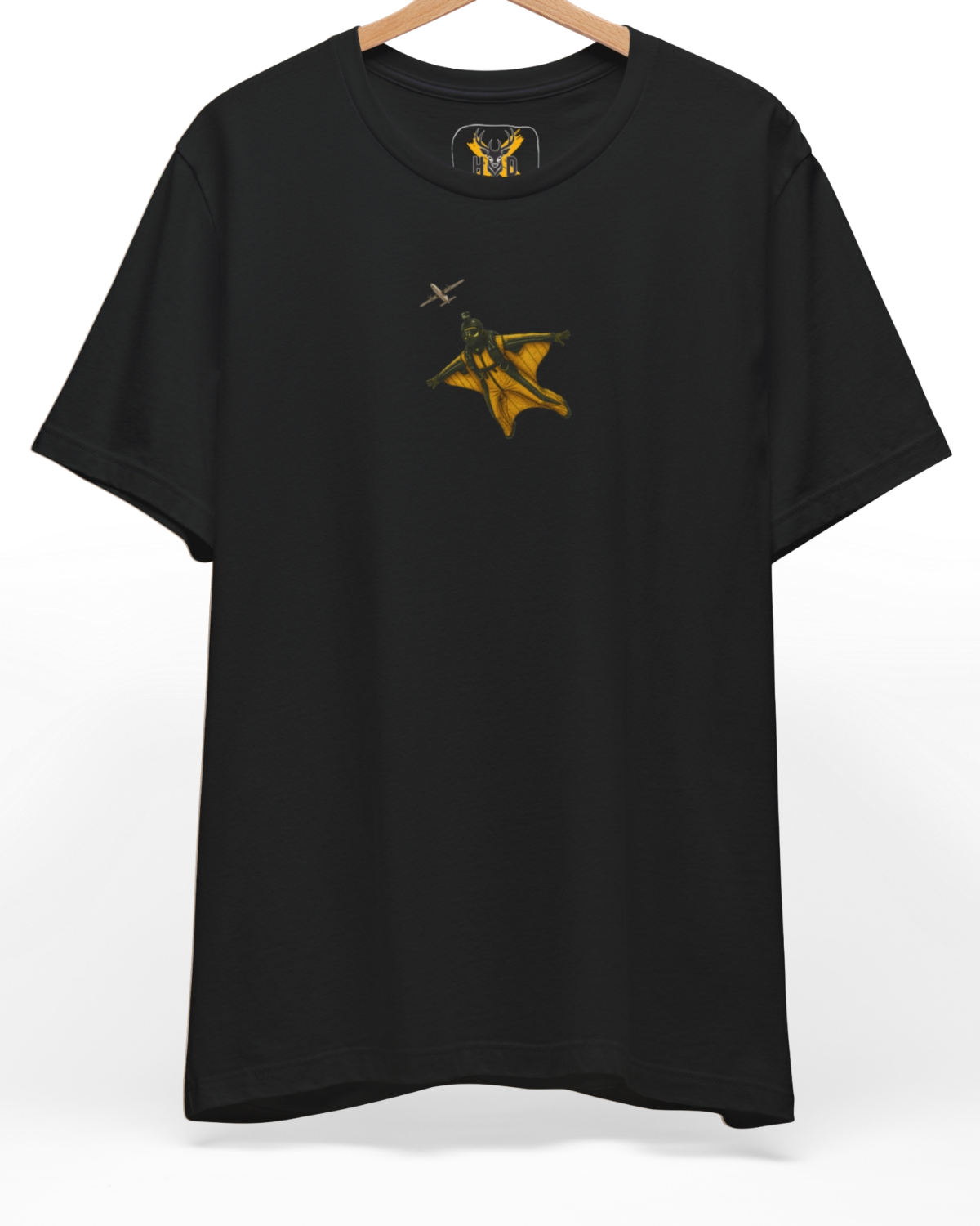 Premium Wingsuit Pilot Tee displaying a high-detail minimalist illustration with a yellow wingsuit flying art concept on a deep teal folded shirt layout, designed by Holydeer Clothing.