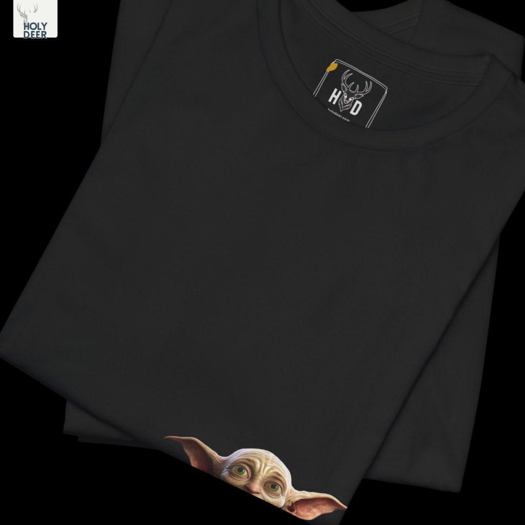 Soft cinematic shadow studio backdrop framing the unique Fantasy Traveler Tee by Holydeer Streetwear, magnifying the clean off-centered wizard goblin art placement and premium unique artist gift presentation.