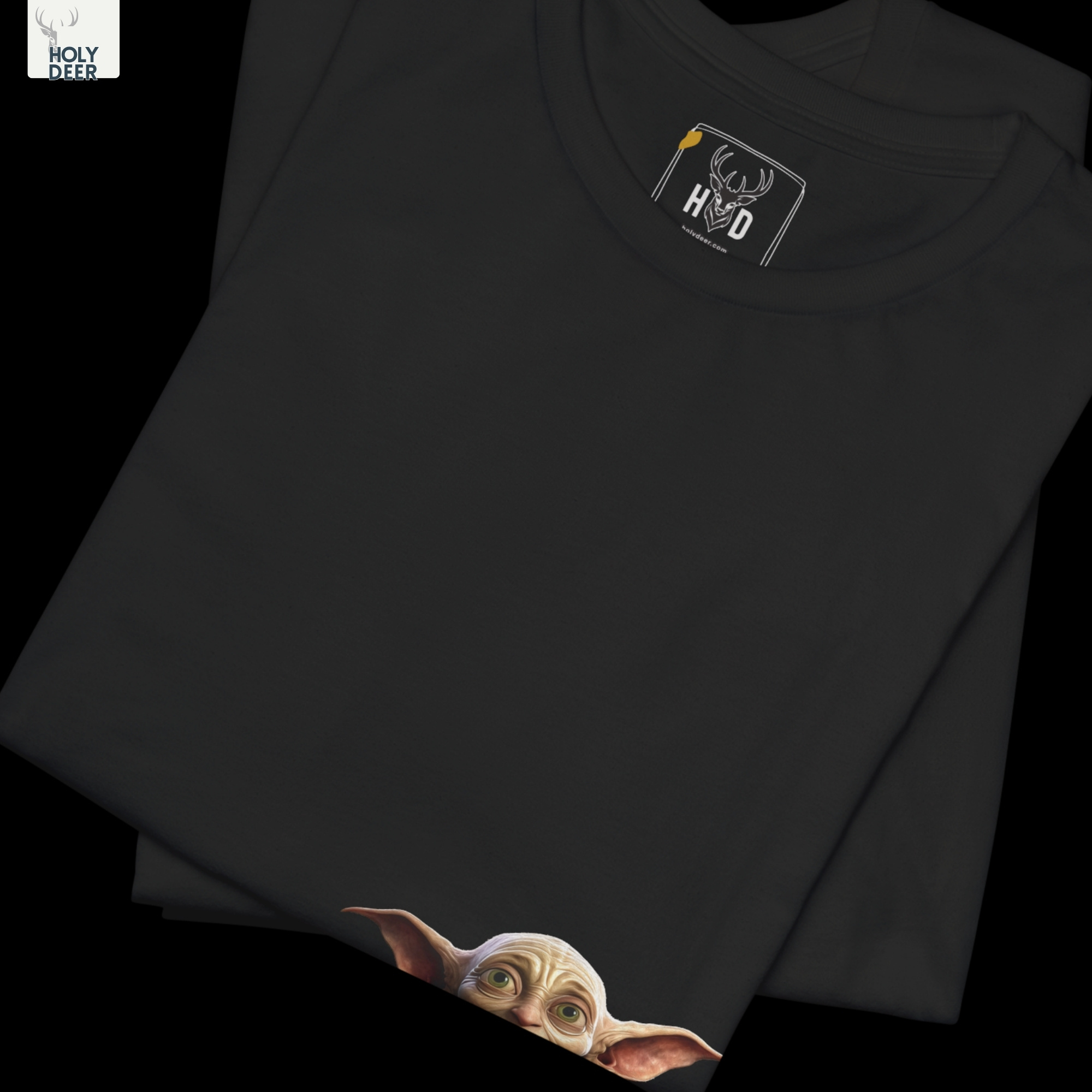 Soft cinematic shadow studio backdrop framing the unique Fantasy Traveler Tee by Holydeer Streetwear, magnifying the clean off-centered wizard goblin art placement and premium unique artist gift presentation.